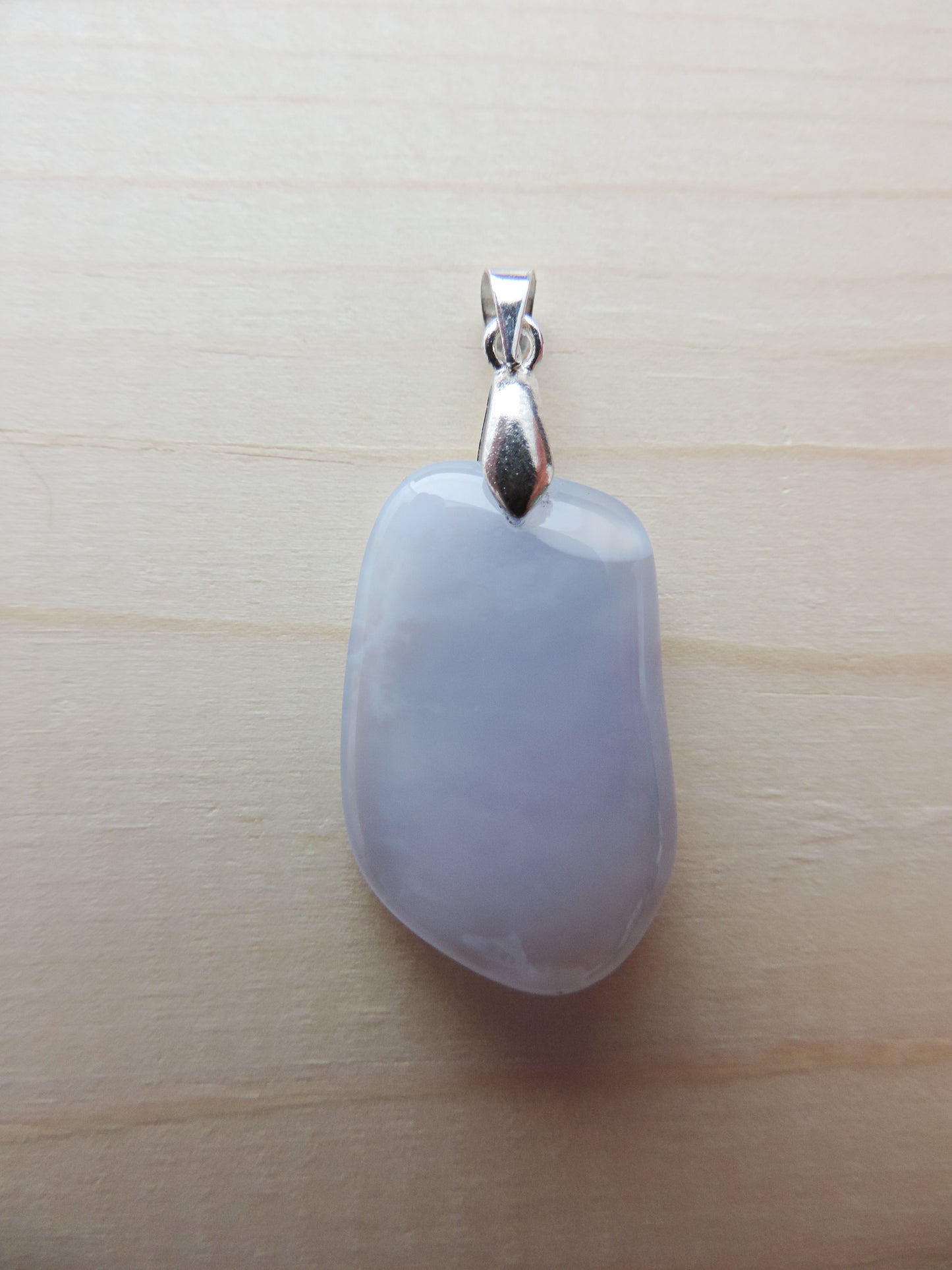 This rare stone is found in only a few locations in Montana, our material is hand collected on private property in the mountains and carried out in backpacks...each piece worth its weight in every step!  The translucent blue agate and its color variations have an alluring effect, many people find the blue agate a relaxing, calming and peaceful stone to wear.  Original and unique in design, each piece is hand crafted by lapidary artists in Montana.