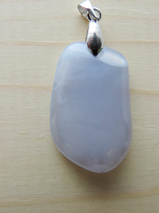 This rare stone is found in only a few locations in Montana, our material is hand collected on private property in the mountains and carried out in backpacks...each piece worth its weight in every step!  The translucent blue agate and its color variations have an alluring effect, many people find the blue agate a relaxing, calming and peaceful stone to wear.  Original and unique in design, each piece is hand crafted by lapidary artists in Montana.