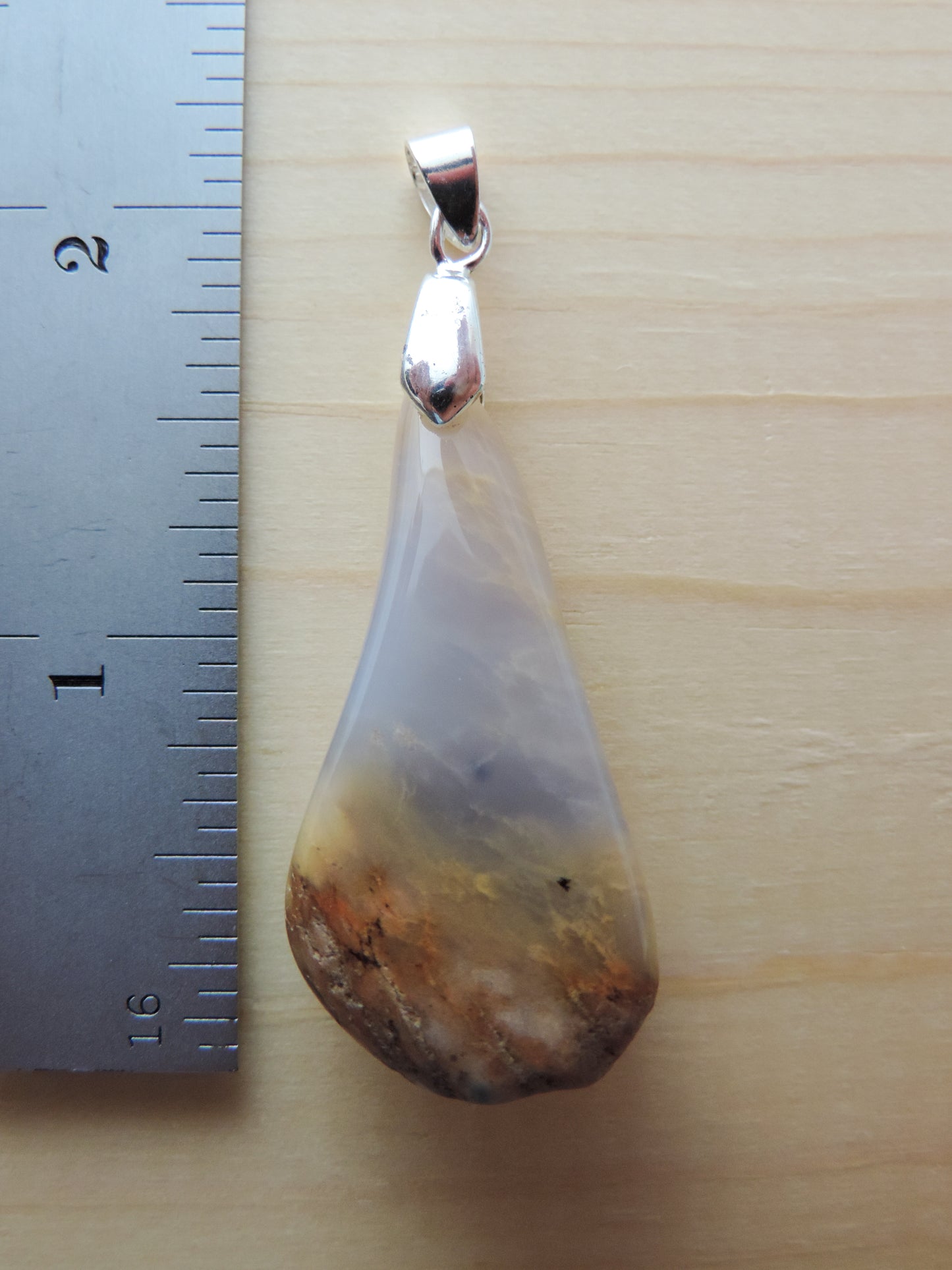 This rare stone is found in only a few locations in Montana, our material is hand collected on private property in the mountains and carried out in backpacks...each piece worth its weight in every step!  The translucent blue agate and its color variations have an alluring effect, many people find the blue agate a relaxing, calming and peaceful stone to wear.  Original and unique in design, each piece is hand crafted by lapidary artists in Montana.