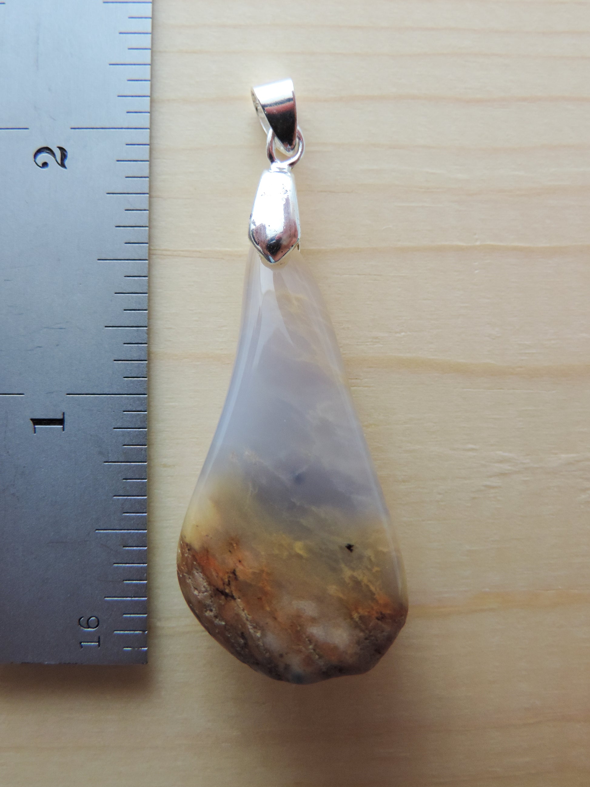 This rare stone is found in only a few locations in Montana, our material is hand collected on private property in the mountains and carried out in backpacks...each piece worth its weight in every step!  The translucent blue agate and its color variations have an alluring effect, many people find the blue agate a relaxing, calming and peaceful stone to wear.  Original and unique in design, each piece is hand crafted by lapidary artists in Montana.