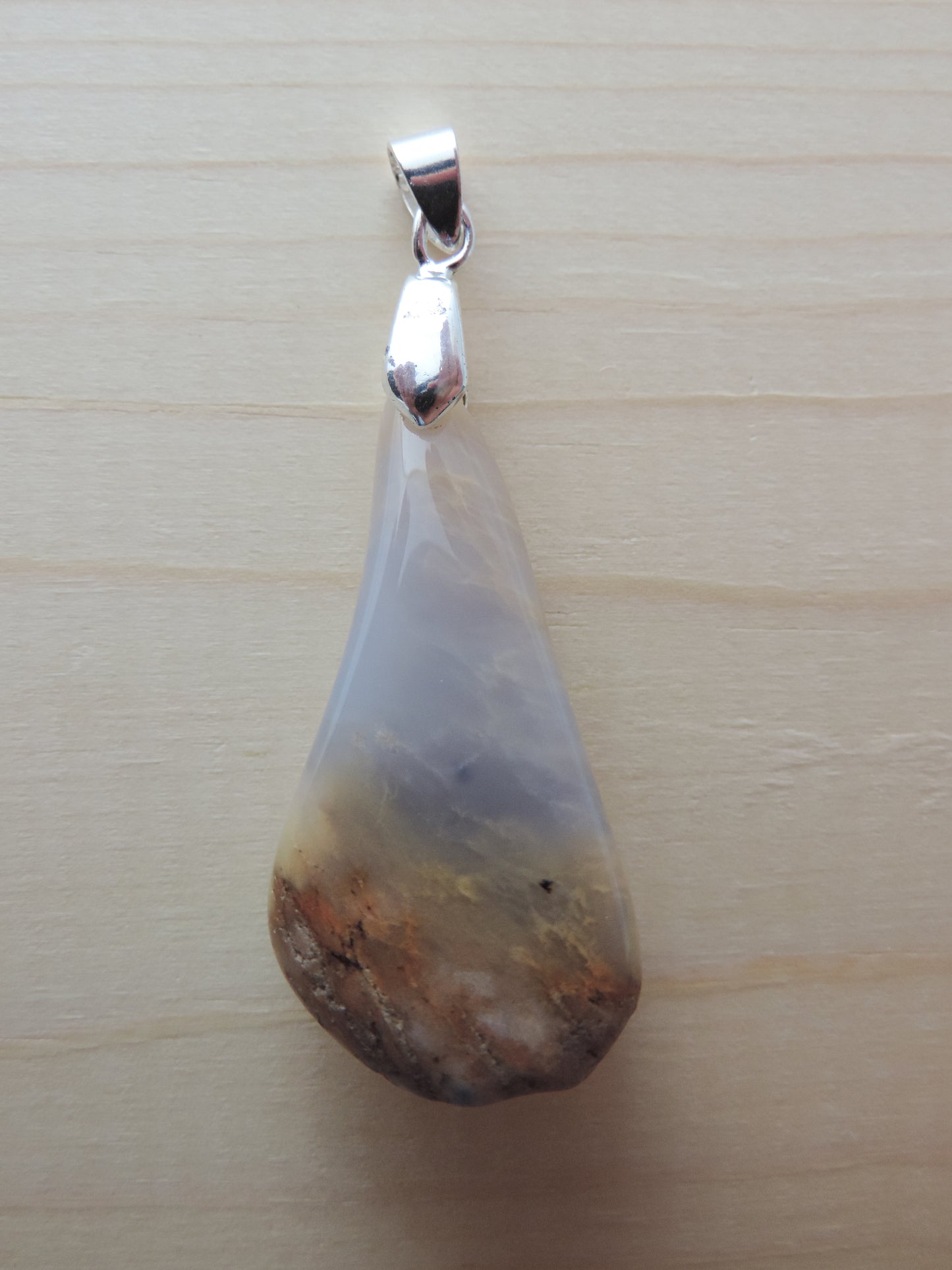 This rare stone is found in only a few locations in Montana, our material is hand collected on private property in the mountains and carried out in backpacks...each piece worth its weight in every step!  The translucent blue agate and its color variations have an alluring effect, many people find the blue agate a relaxing, calming and peaceful stone to wear.  Original and unique in design, each piece is hand crafted by lapidary artists in Montana.