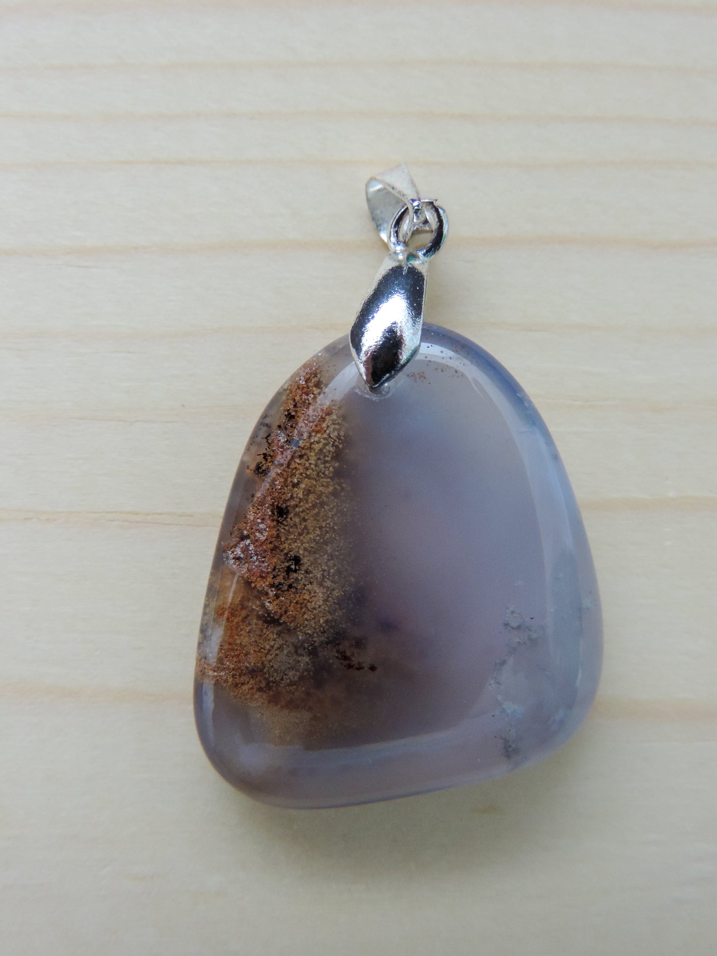 This rare stone is found in only a few locations in Montana, our material is hand collected on private property in the mountains and carried out in backpacks...each piece worth its weight in every step!  The translucent blue agate and its color variations have an alluring effect, many people find the blue agate a relaxing, calming and peaceful stone to wear.  Original and unique in design, each piece is hand crafted by lapidary artists in Montana.