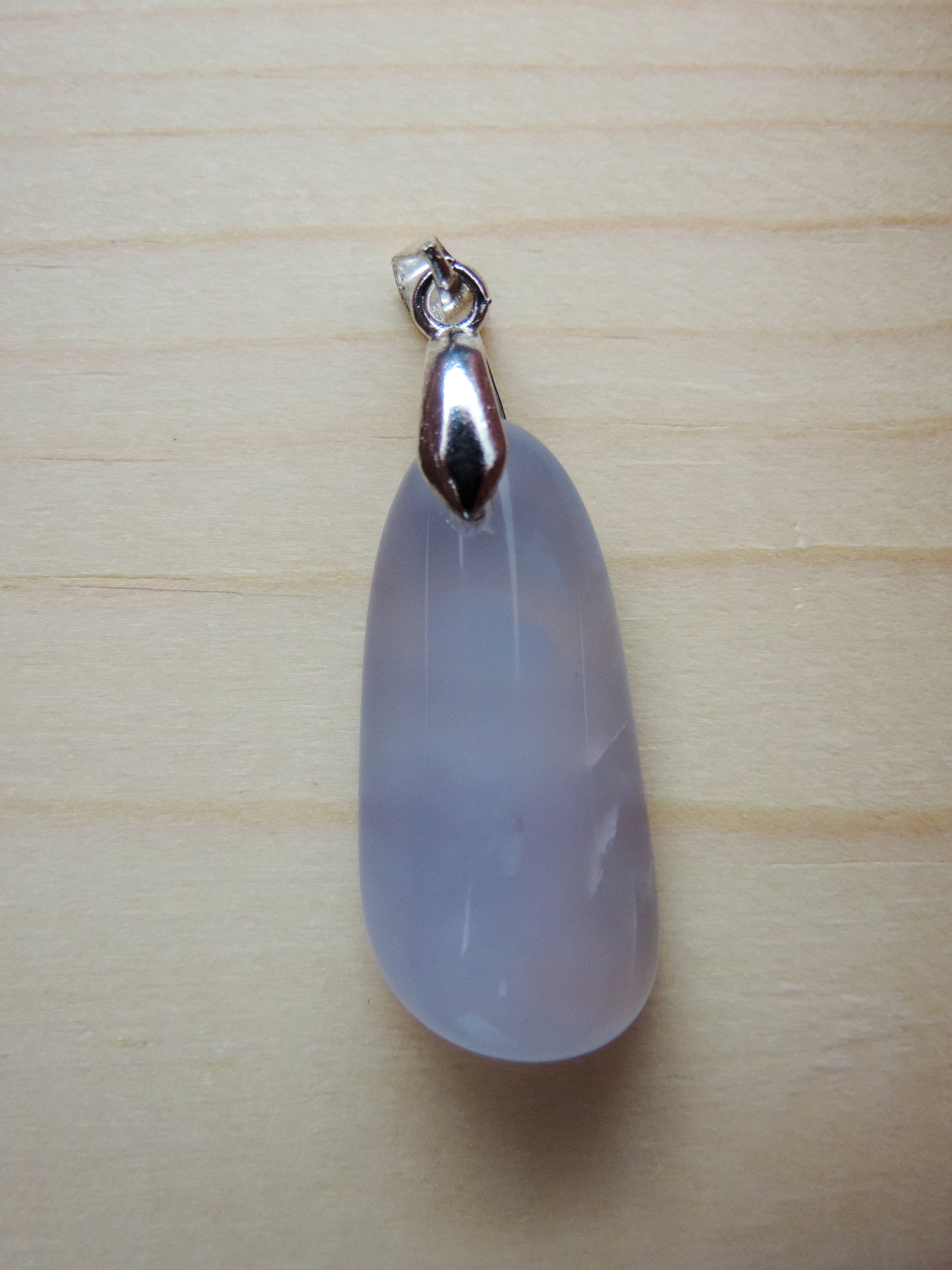 This rare stone is found in only a few locations in Montana, our material is hand collected on private property in the mountains and carried out in backpacks...each piece worth its weight in every step!  The translucent blue agate and its color variations have an alluring effect, many people find the blue agate a relaxing, calming and peaceful stone to wear.  Original and unique in design, each piece is hand crafted by lapidary artists in Montana.