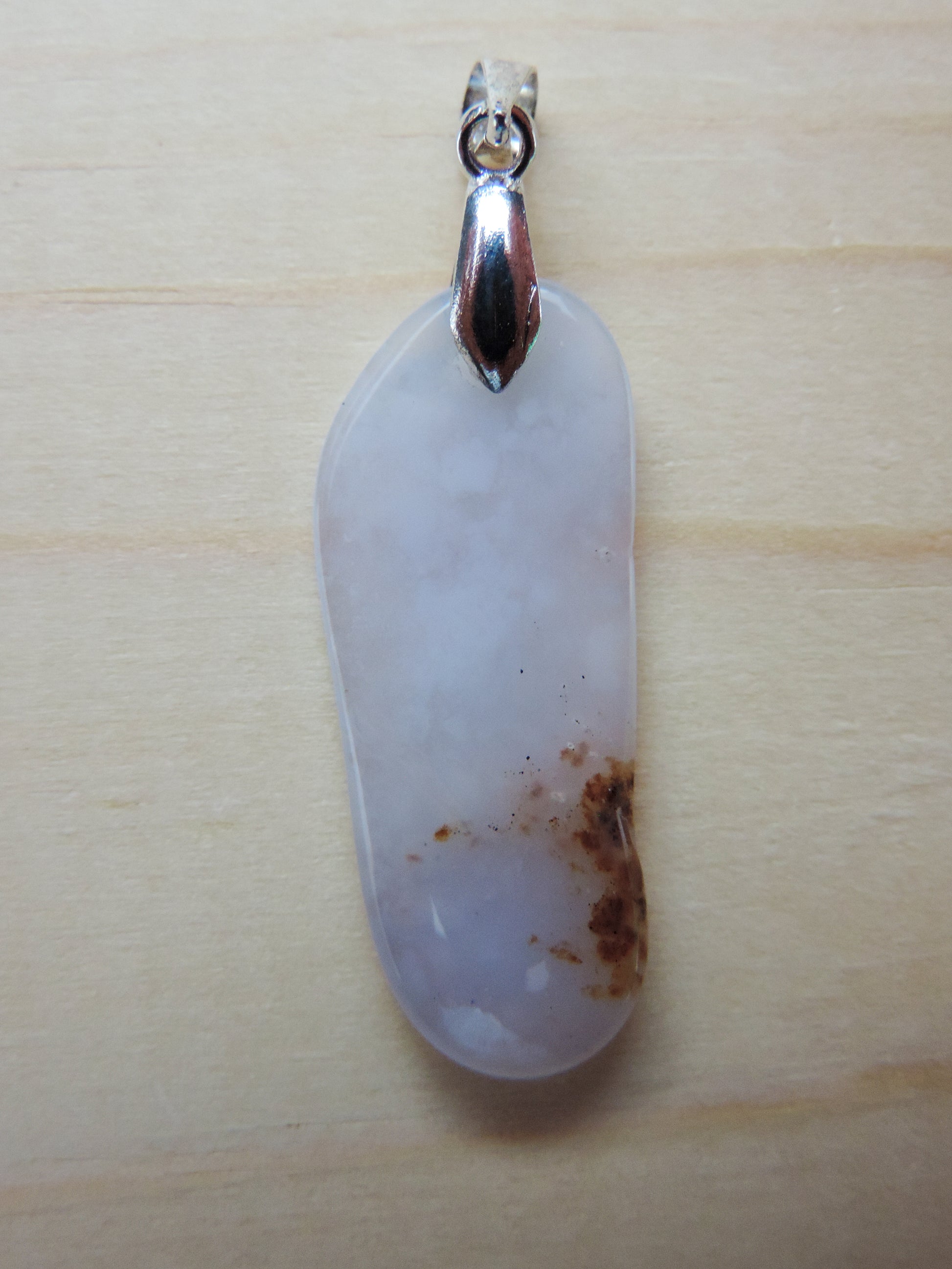 This rare stone is found in only a few locations in Montana, our material is hand collected on private property in the mountains and carried out in backpacks...each piece worth its weight in every step!  The translucent blue agate and its color variations have an alluring effect, many people find the blue agate a relaxing, calming and peaceful stone to wear.  Original and unique in design, each piece is hand crafted by lapidary artists in Montana.