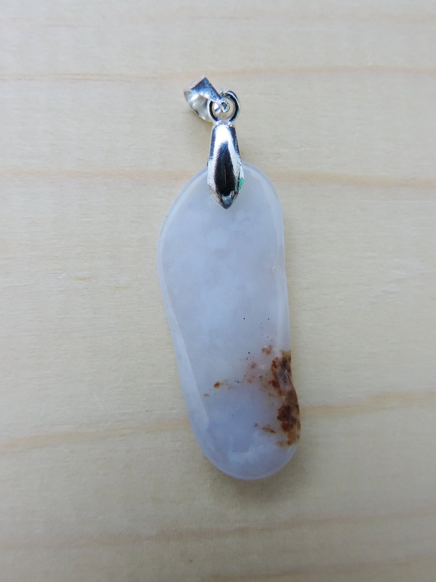 This rare stone is found in only a few locations in Montana, our material is hand collected on private property in the mountains and carried out in backpacks...each piece worth its weight in every step!  The translucent blue agate and its color variations have an alluring effect, many people find the blue agate a relaxing, calming and peaceful stone to wear.  Original and unique in design, each piece is hand crafted by lapidary artists in Montana.