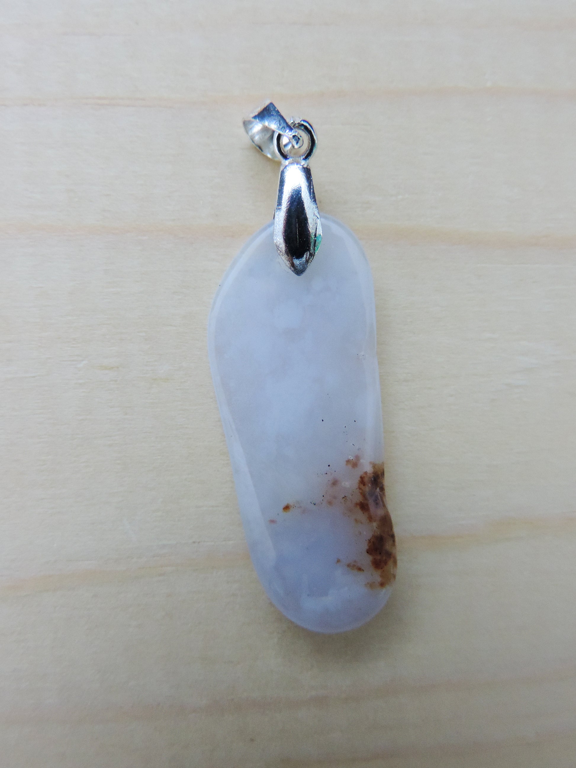 This rare stone is found in only a few locations in Montana, our material is hand collected on private property in the mountains and carried out in backpacks...each piece worth its weight in every step!  The translucent blue agate and its color variations have an alluring effect, many people find the blue agate a relaxing, calming and peaceful stone to wear.  Original and unique in design, each piece is hand crafted by lapidary artists in Montana.