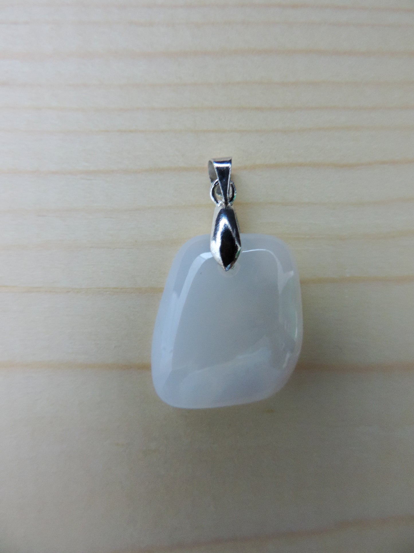 This rare stone is found in only a few locations in Montana, our material is hand collected on private property in the mountains and carried out in backpacks...each piece worth its weight in every step!  The translucent blue agate and its color variations have an alluring effect, many people find the blue agate a relaxing, calming and peaceful stone to wear.  Original and unique in design, each piece is hand crafted by lapidary artists in Montana.