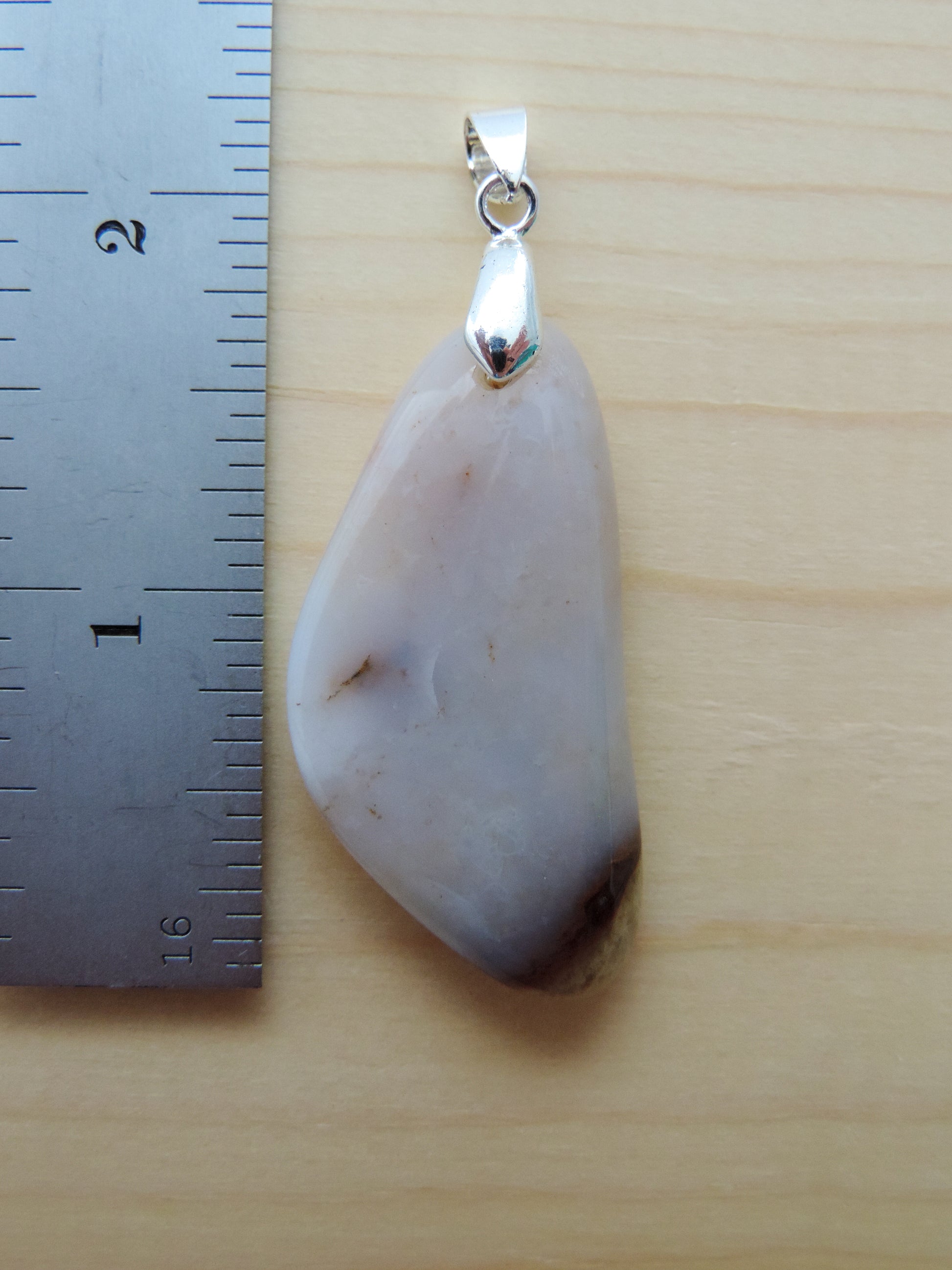 This rare stone is found in only a few locations in Montana, our material is hand collected on private property in the mountains and carried out in backpacks...each piece worth its weight in every step!  The translucent blue agate and its color variations have an alluring effect, many people find the blue agate a relaxing, calming and peaceful stone to wear.  Original and unique in design, each piece is hand crafted by lapidary artists in Montana.