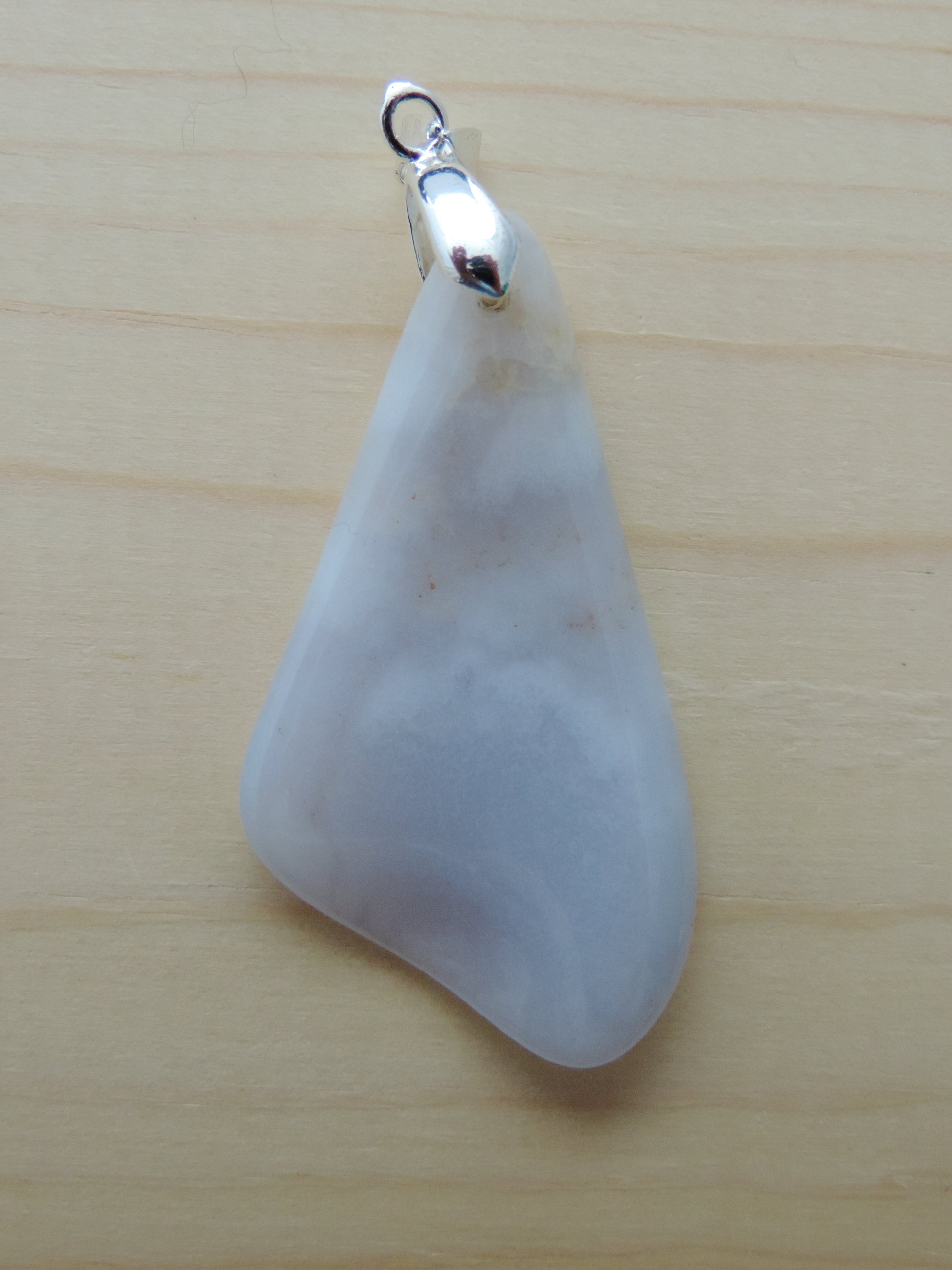 This rare stone is found in only a few locations in Montana, our material is hand collected on private property in the mountains and carried out in backpacks...each piece worth its weight in every step!  The translucent blue agate and its color variations have an alluring effect, many people find the blue agate a relaxing, calming and peaceful stone to wear.  Original and unique in design, each piece is hand crafted by lapidary artists in Montana.