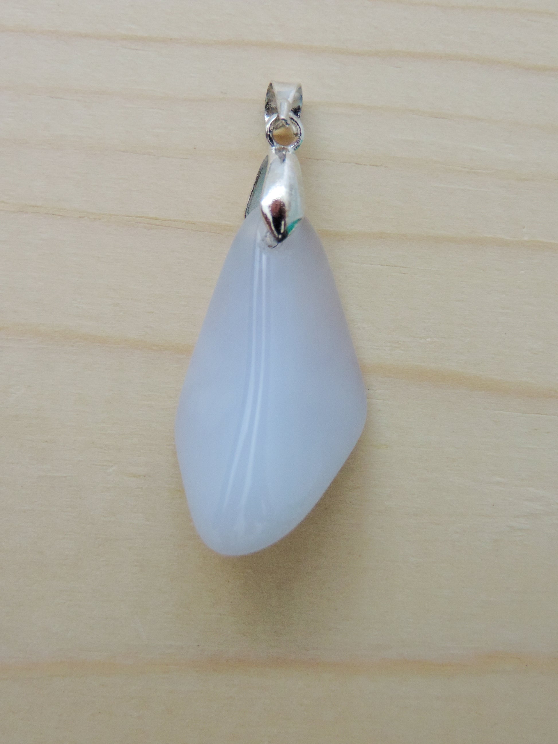 This rare stone is found in only a few locations in Montana, our material is hand collected on private property in the mountains and carried out in backpacks...each piece worth its weight in every step!  The translucent blue agate and its color variations have an alluring effect, many people find the blue agate a relaxing, calming and peaceful stone to wear.  Original and unique in design, each piece is hand crafted by lapidary artists in Montana.