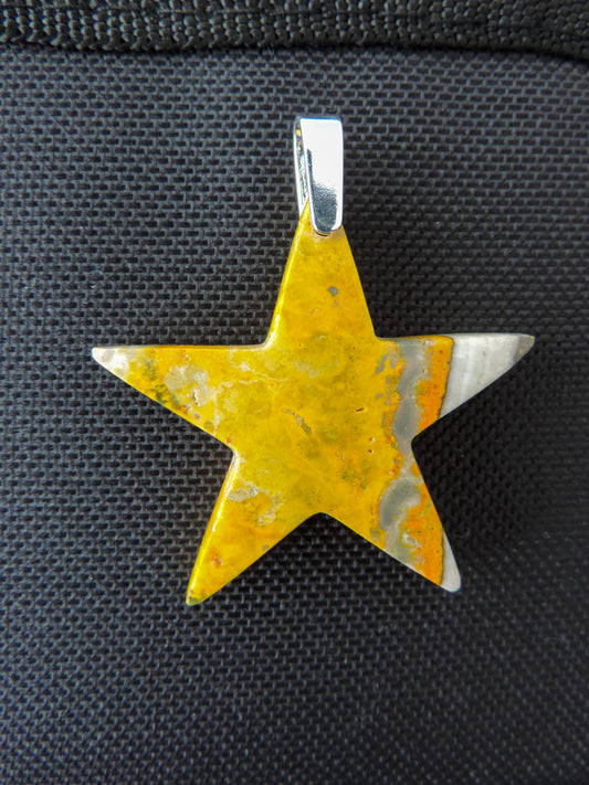 Bumblebee Jasper pendant is named for its yellow, white, orange and black colored banding which resembles a common bumblebee.  This mineral was discovered in the Papandayan Volcano, West Java Province, Indonesia. The pendant bail is authentic 925 sterling silver.     Our hand crafted jewelry is photographed next to a ruler for size.  This stone is a natural color, no dyes or heat treatment have been used.