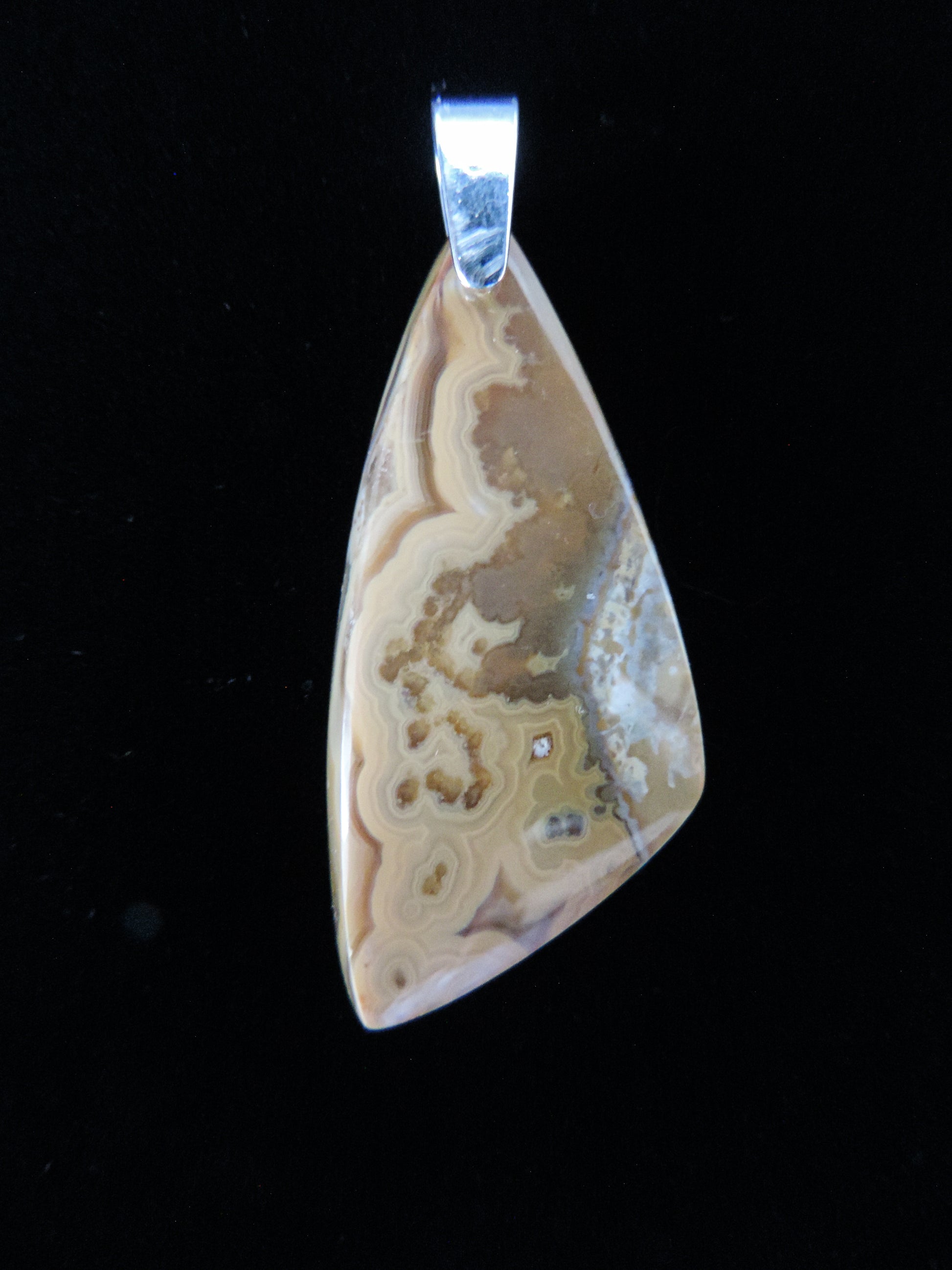 Brown Lace Agate Pendant from West Sumatra.  Indonesian Brown Lace Agate pendants exhibit a wide variety of colors and amazing complexity.  No two agates are exactly alike,