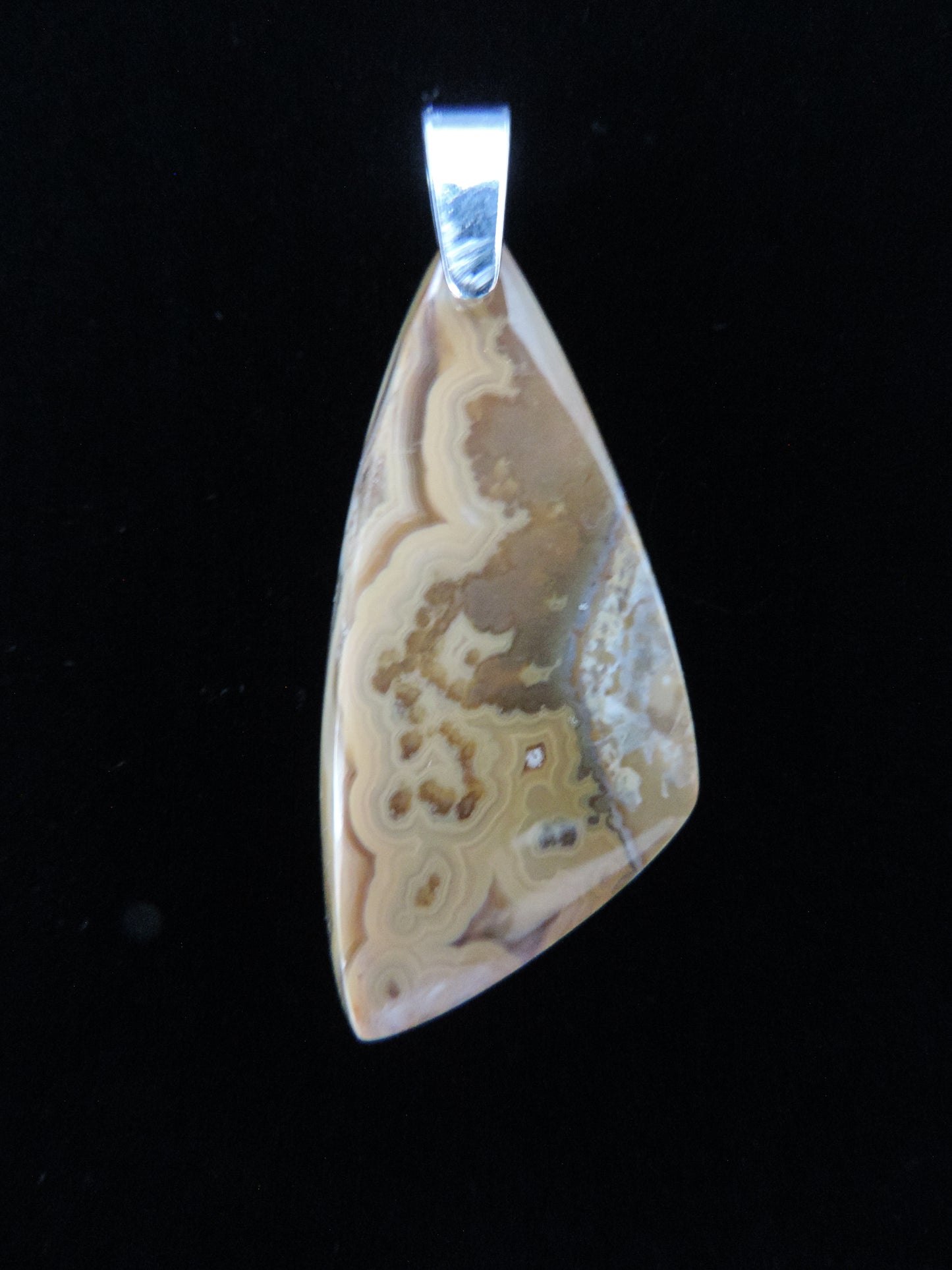 Find your perfect Indonesian Brown Lace Agate pendant on our store! The pendant bail is authentic 925 sterling silver.