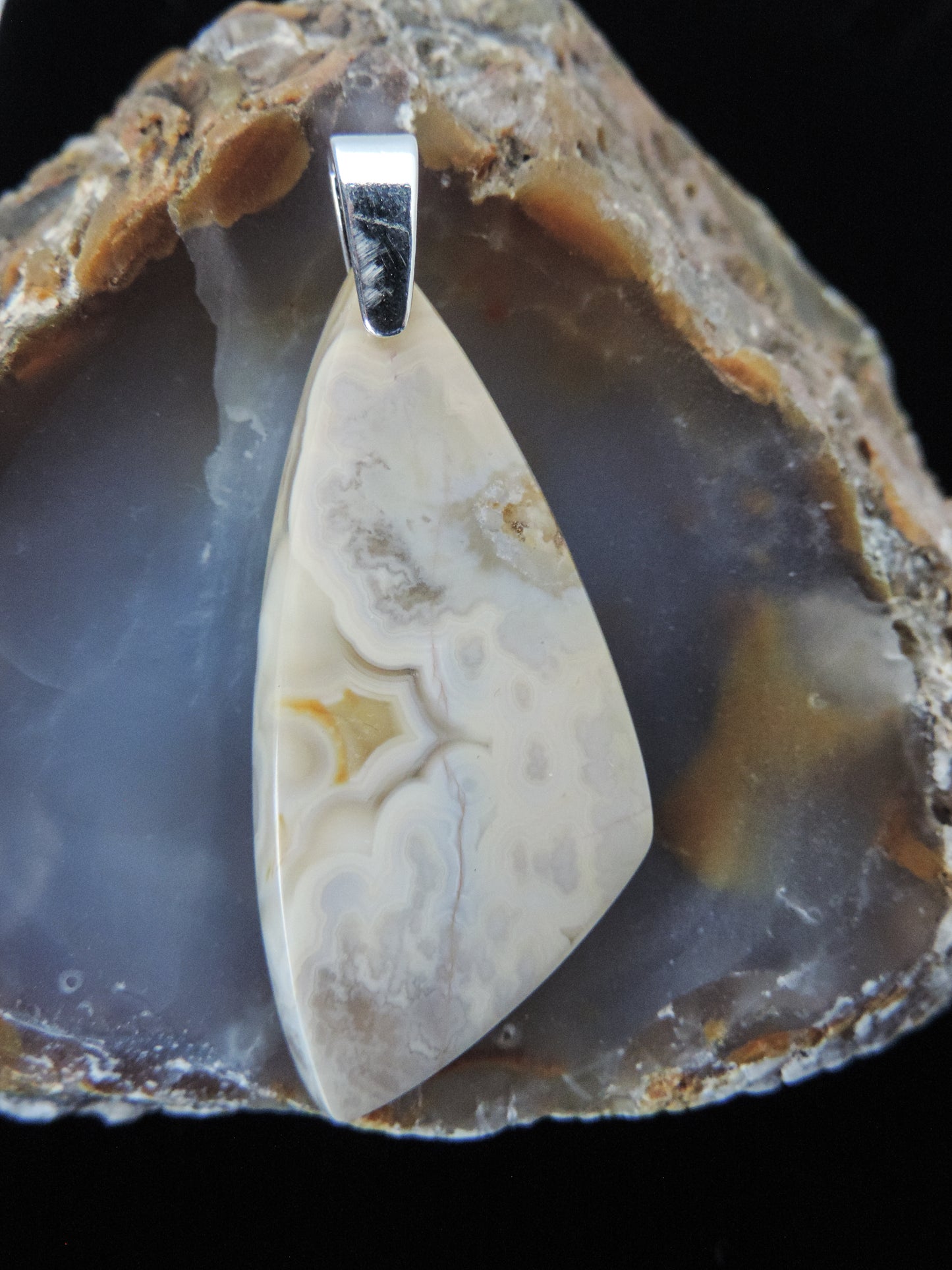 Find your perfect Indonesian Agate pendant on our store! The pendant bail is authentic 925 sterling silver. Our hand crafted jewelry pendant is photographed next to a ruler for size