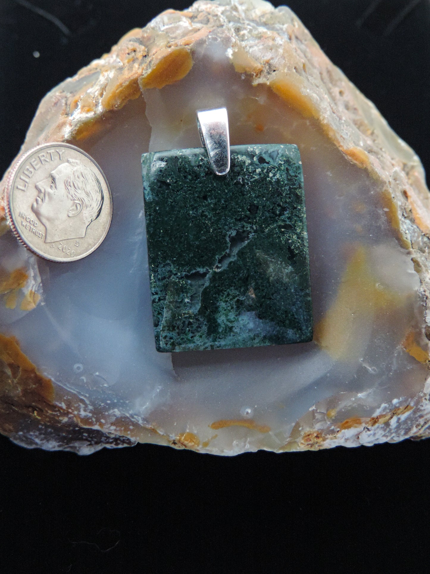 Our hand crafted jewelry pendant is photographed next to a ruler for size. This stone is a natural color, no dyes or heat treatment have been used.