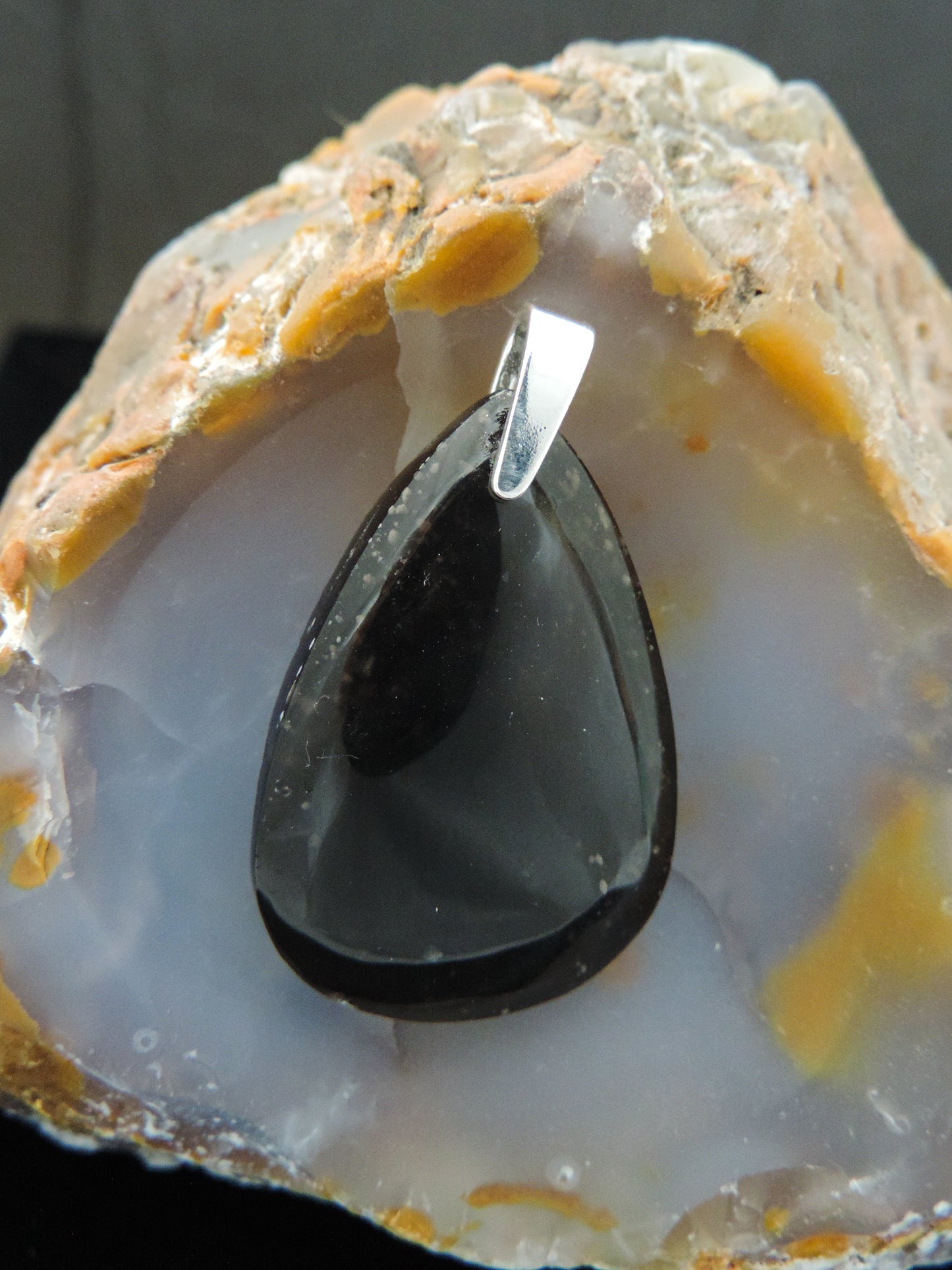 The Agni Manitite pendants on our store are unique in design. One side is smooth and polished while the other side looks rough and irregular, a representation of its natural state. The pendant can be worn with either side facing out. The bail is authentic 925 sterling silver. Often referred to as “Pearl of Divine Fire”, Agni Manitite is a rare stone found in the Indonesian