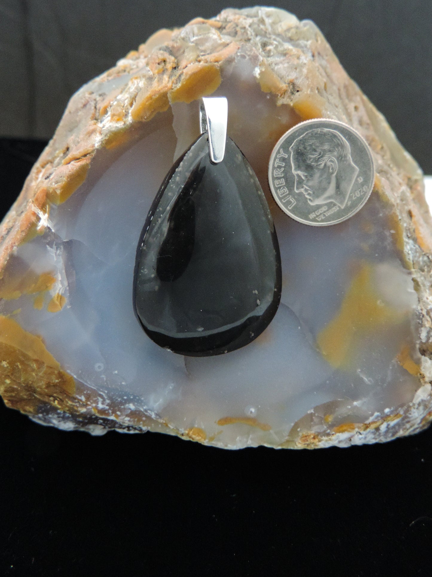 The Agni Manitite pendants on our store are unique in design. One side is smooth and polished while the other side looks rough and irregular, a representation of its natural state. The pendant can be worn with either side facing out. The bail is authentic 925 sterling silver. Often referred to as “Pearl of Divine Fire”, Agni Manitite is a rare stone found in the Indonesian