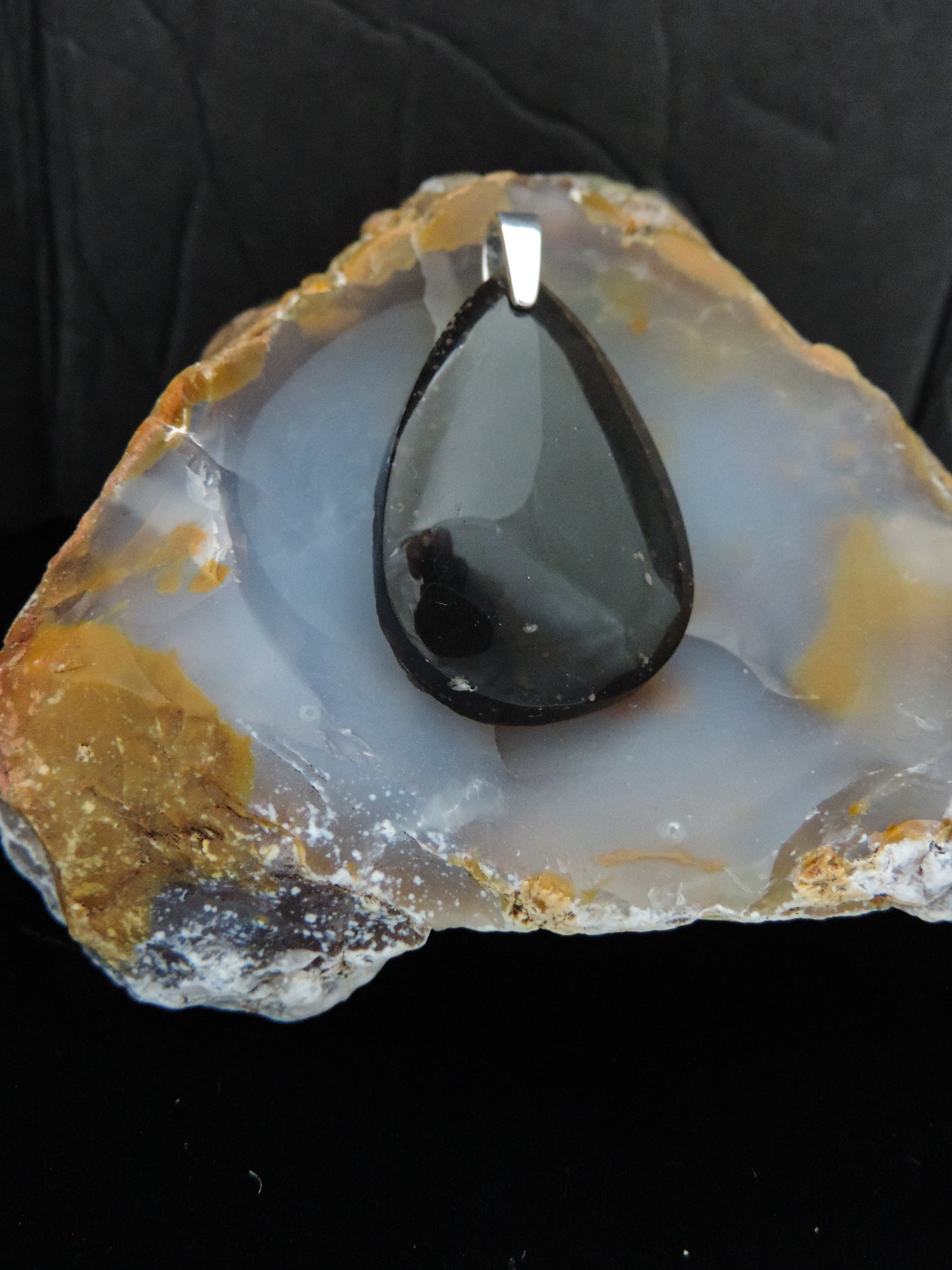 The Agni Manitite pendants on our store are unique in design. One side is smooth and polished while the other side looks rough and irregular, a representation of its natural state. The pendant can be worn with either side facing out. The bail is authentic 925 sterling silver. Often referred to as “Pearl of Divine Fire”, Agni Manitite is a rare stone found in the Indonesian