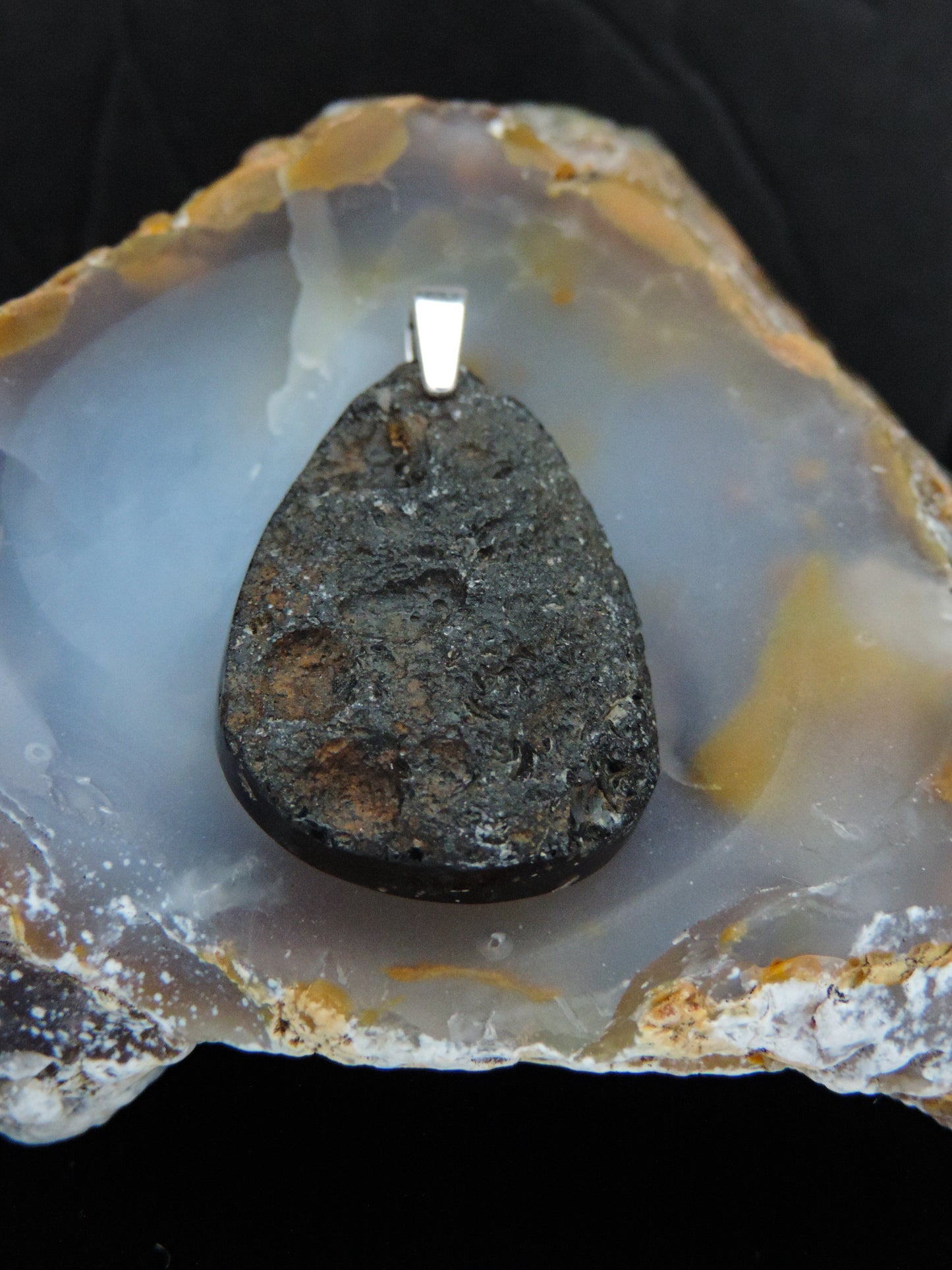 The Agni Manitite pendants on our store are unique in design. One side is smooth and polished while the other side looks rough and irregular, a representation of its natural state. The pendant can be worn with either side facing out. The bail is authentic 925 sterling silver. Often referred to as “Pearl of Divine Fire”, Agni Manitite is a rare stone found in the Indonesian