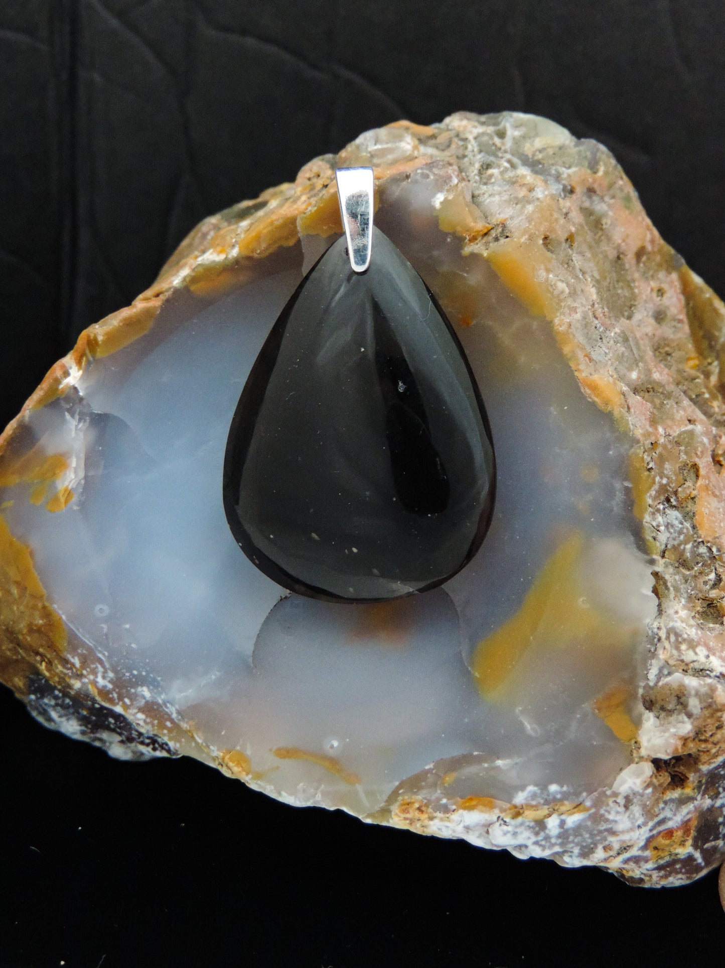 The Agni Manitite pendants on our store are unique in design. One side is smooth and polished while the other side looks rough and irregular, a representation of its natural state. The pendant can be worn with either side facing out. The bail is authentic 925 sterling silver. Often referred to as “Pearl of Divine Fire”,