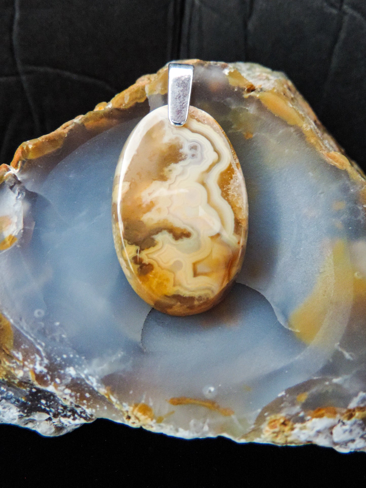 Brown Lace Agate pendant from West Sumatra. Indonesian Agate pendants exhibit a wide variety of colors and amazing complexity. No two agates are exactly alike