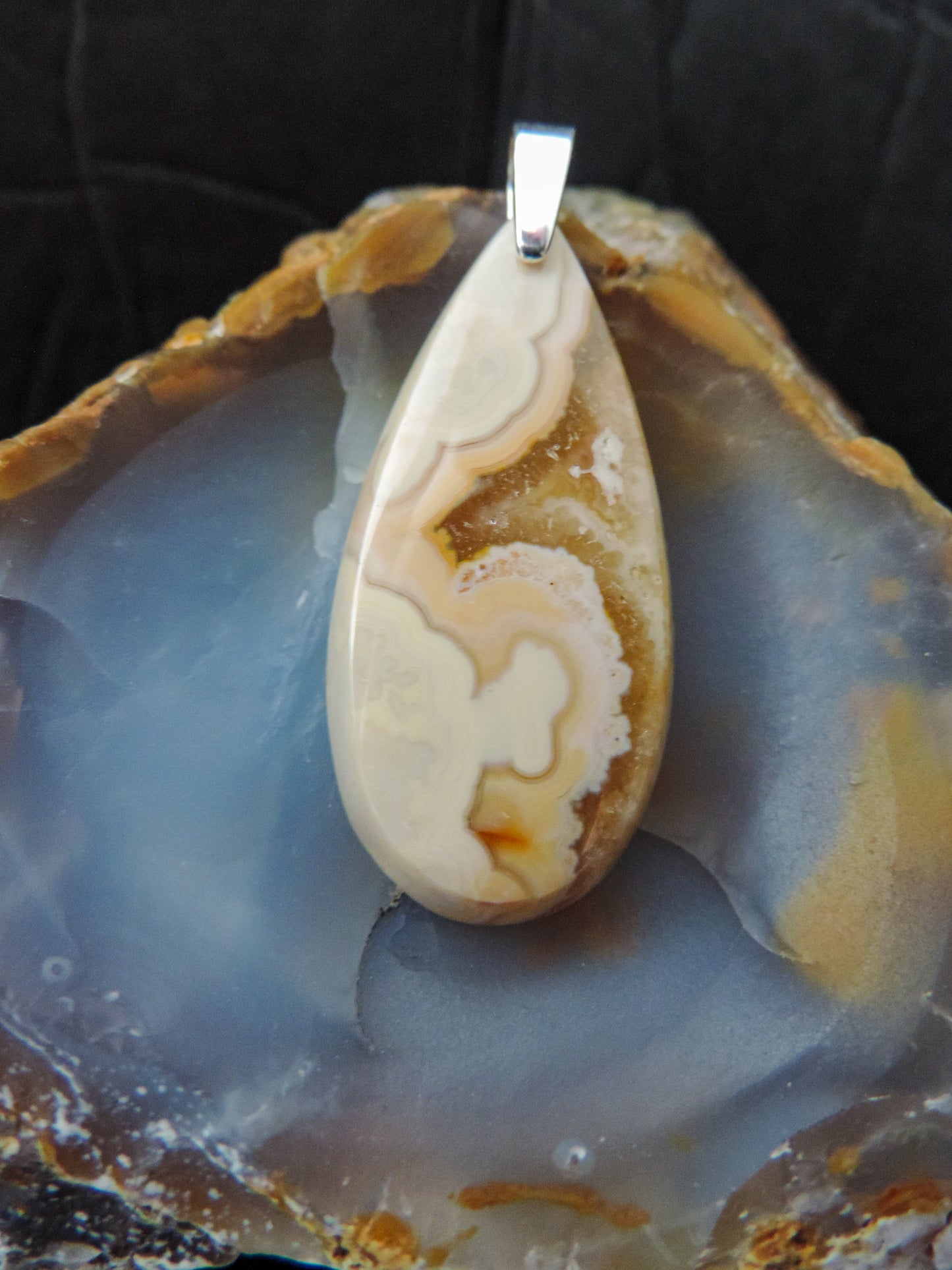 Find your perfect Indonesian Brown Lace Agate pendant on our store! The pendant bail is authentic 925 sterling silver.