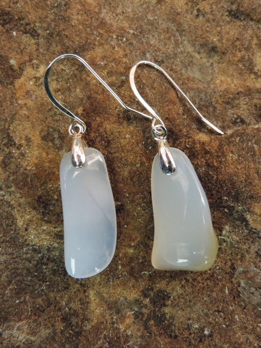 The bail and earring wires are authentic 925 sterling silver.  Wear these original earrings and stand out in a crowd!  Known as the Treasure State, Montana’s landscape is an abundant resource for precious and semi-precious stones.  One of the semi-precious stones, Madison Blue Agate, are featured in these earrings.