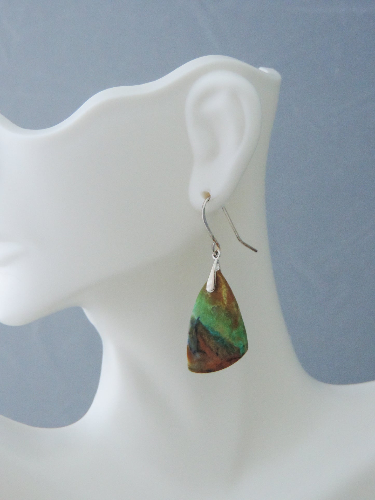 The bail and earring wires are authentic 925 sterling silver. Feel treasured when you wear these earrings! Extremely rare and lovely, Indonesian Blue Opalized Wood is a cherished material used by lapidary artists for creating stunning pieces of jewelry. The material was first found as pebbles and rounded stones in streams and near the slopes of three volcanoes in the West Java Province.