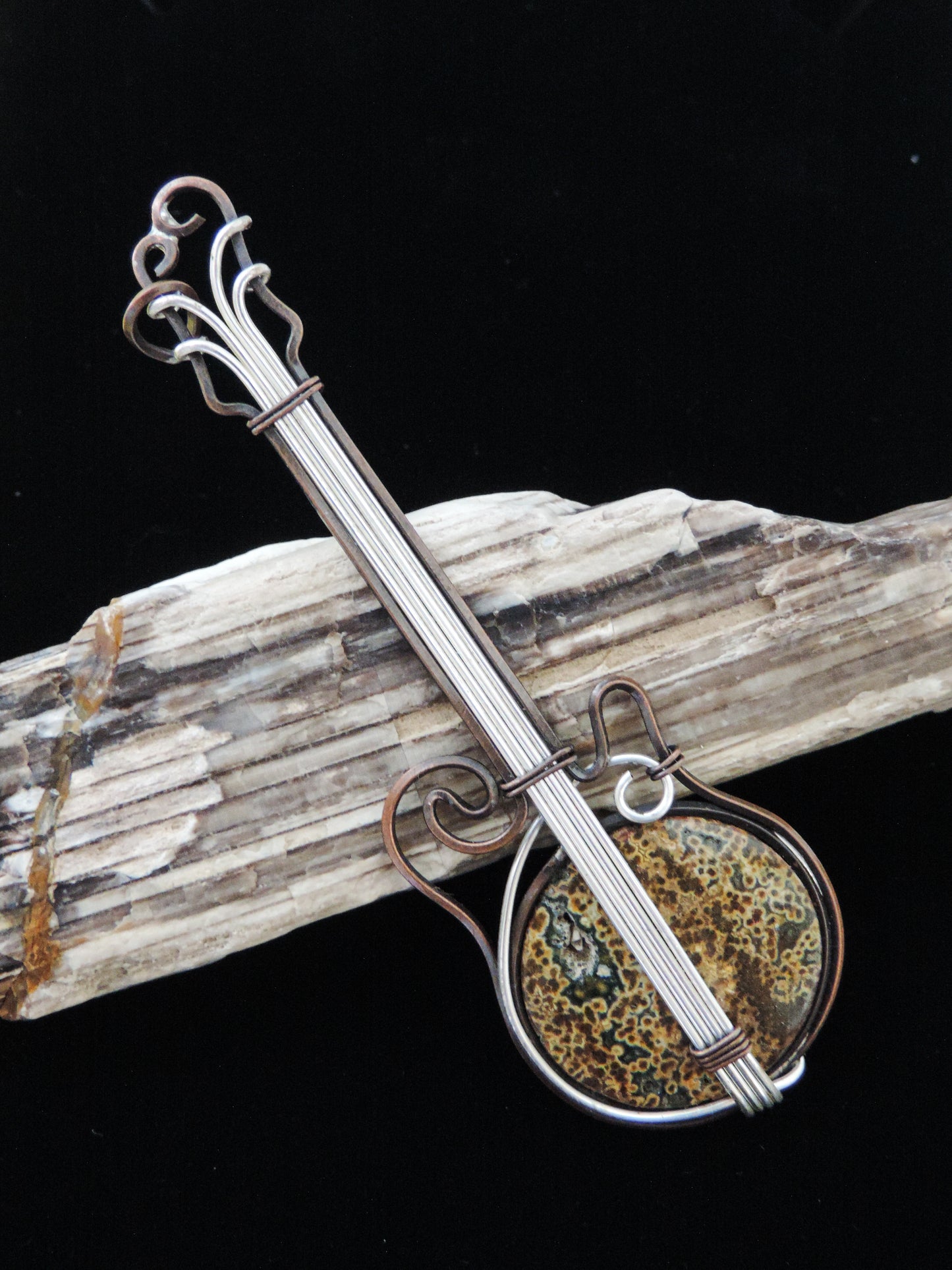 Indonesian River Jasper & Mixed Metals guitar pendant.