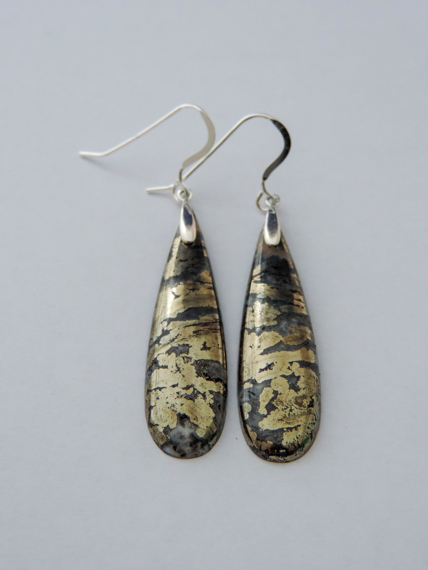 Marcasite Earrings with Sterling Silver wire are ready to dazzle your admirers, just like Queen Cleopatra!!Marcasite has been a valued by many civilizations throughout history. The word marcasite is a derivative of the Arabic word “markashatsa,” or “fire stone.” This term isn’t in reference to its metallic shine. Marcasite can actually spark when struck with iron or flint. The ancient Incans, Greeks and Egyptians all valued marcasite, even Cleopatra adorned herself in marcasite gemstones.