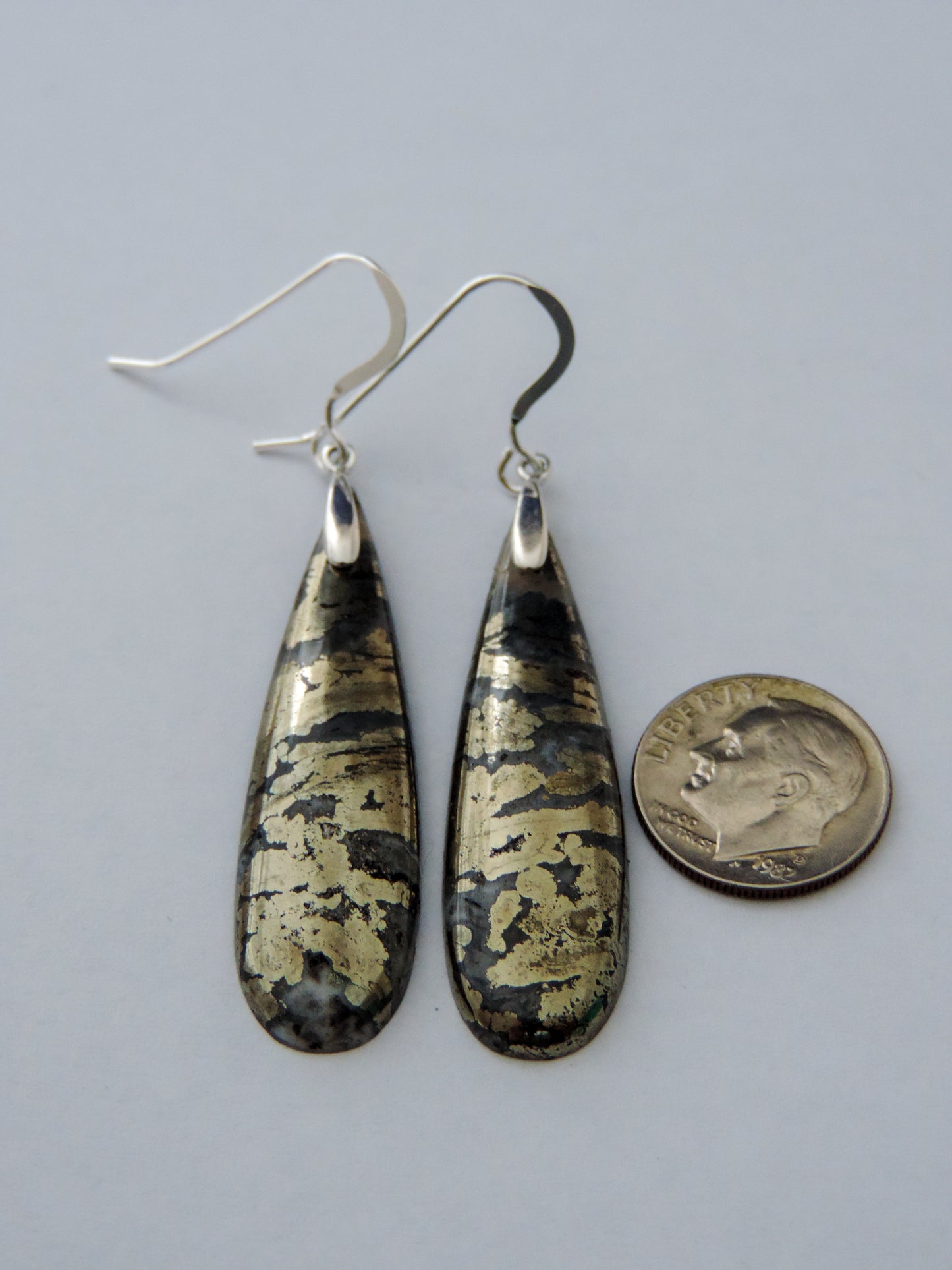 Marcasite Earrings with Sterling Silver wire are ready to dazzle your admirers, just like Queen Cleopatra!!Marcasite has been a valued by many civilizations throughout history. The word marcasite is a derivative of the Arabic word “markashatsa,” or “fire stone.” This term isn’t in reference to its metallic shine. Marcasite can actually spark when struck with iron or flint. The ancient Incans, Greeks and Egyptians all valued marcasite, even Cleopatra adorned herself in marcasite gemstones.