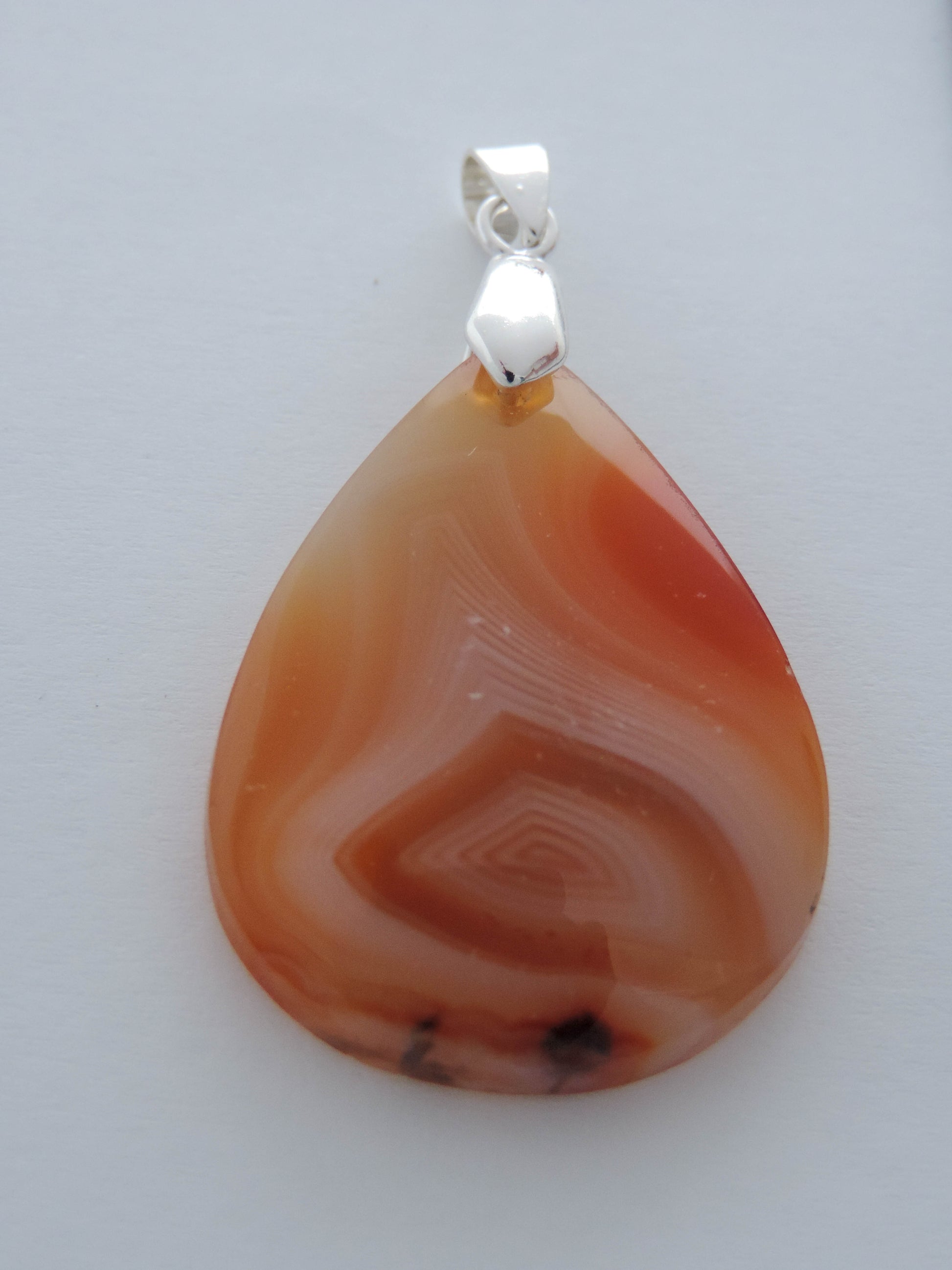 Find your perfect Indonesian Agate Pendant on our store!   Our hand crafted pendant is photographed next to a ruler for size.  This stone is a natural color, no dyes or heat treatment have been used.