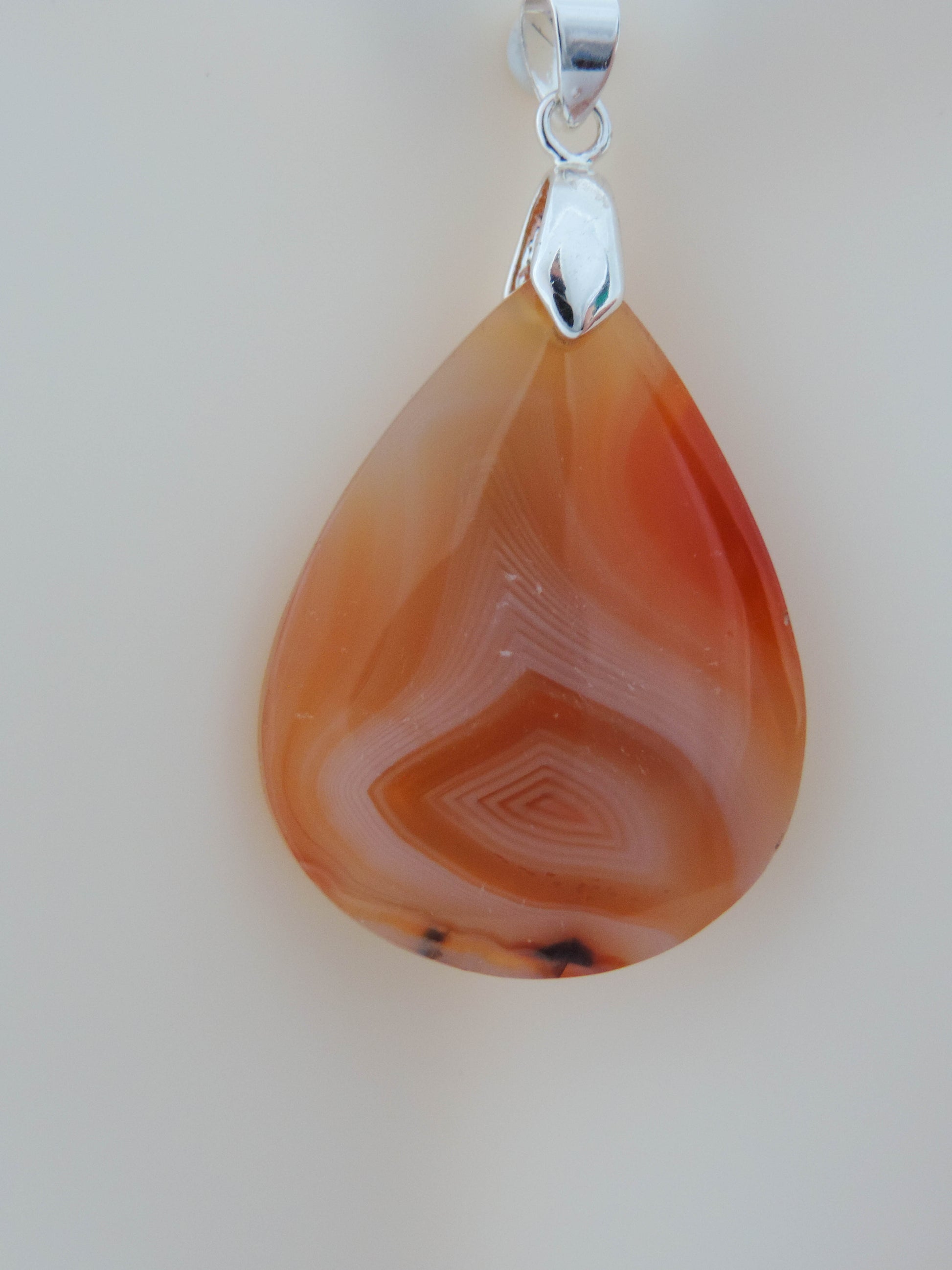 Find your perfect Indonesian Agate Pendant on our store!   Our hand crafted pendant is photographed next to a ruler for size.  This stone is a natural color, no dyes or heat treatment have been used.