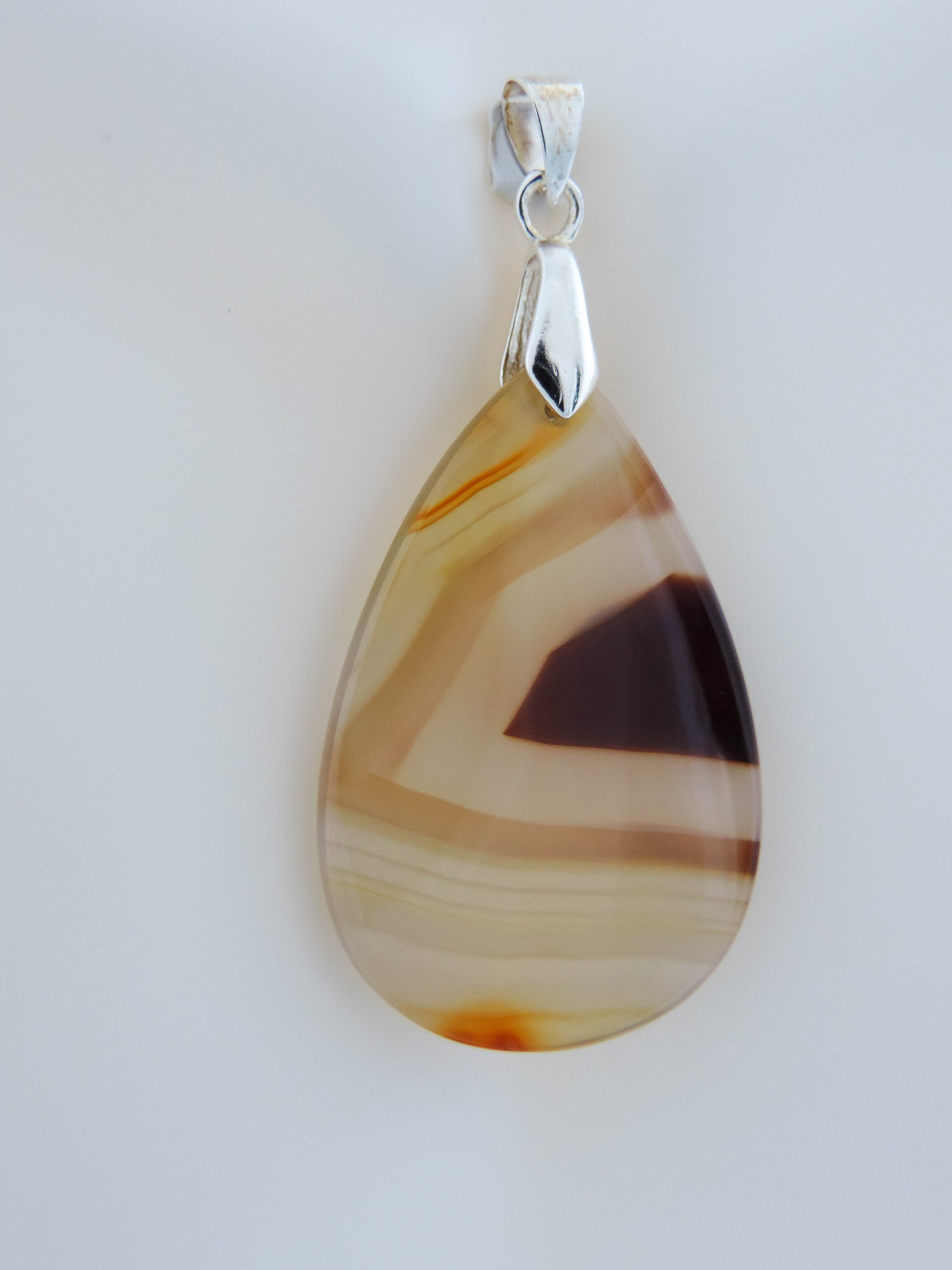 Timor Agate pendant from Sumatra.  Indonesian Agates exhibit a wide variety of colors and amazing complexity.  No two agates are exactly alike, each one being a unique and beautiful creation!