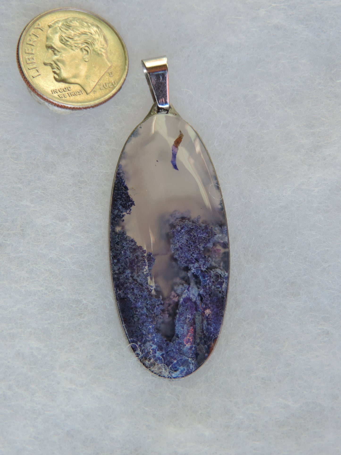 Find your perfect Indonesian Agate on our store! Our hand crafted jewelry pendant is photographed next to a ruler for size. It was photographed without filters on automatic setting in natural light; however, slight color variations may occur due to digitization. Natural stones can have nooks and crannies, inclusions or small cracks, these distinguishing features lend character to the piece.