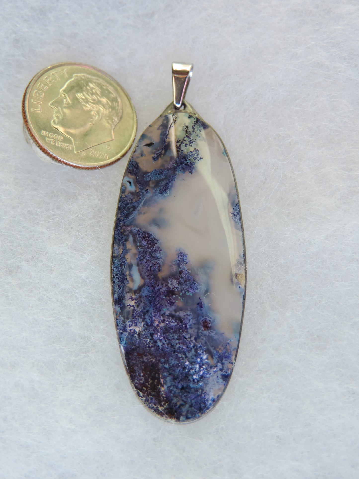 Find your perfect Indonesian Moss Agate on our store! Our hand crafted jewelry pendant is photographed next to a ruler for size. It was photographed without filters on automatic setting in natural light; however, slight color variations may occur due to digitization. Natural stones can have nooks and crannies, inclusions or small cracks, these distinguishing features lend character to the piece.