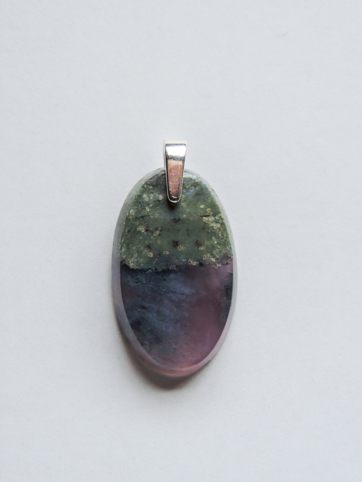 Purple Moss Agate & Sterling Silver Pendant. Purple gemstones hold significant and powerful spiritual qualities. Purple has been associated with wealth, passion, ambition, magic, awareness, mystery, tranquility, inspiration, understanding, calmness and wisdom to name a few.