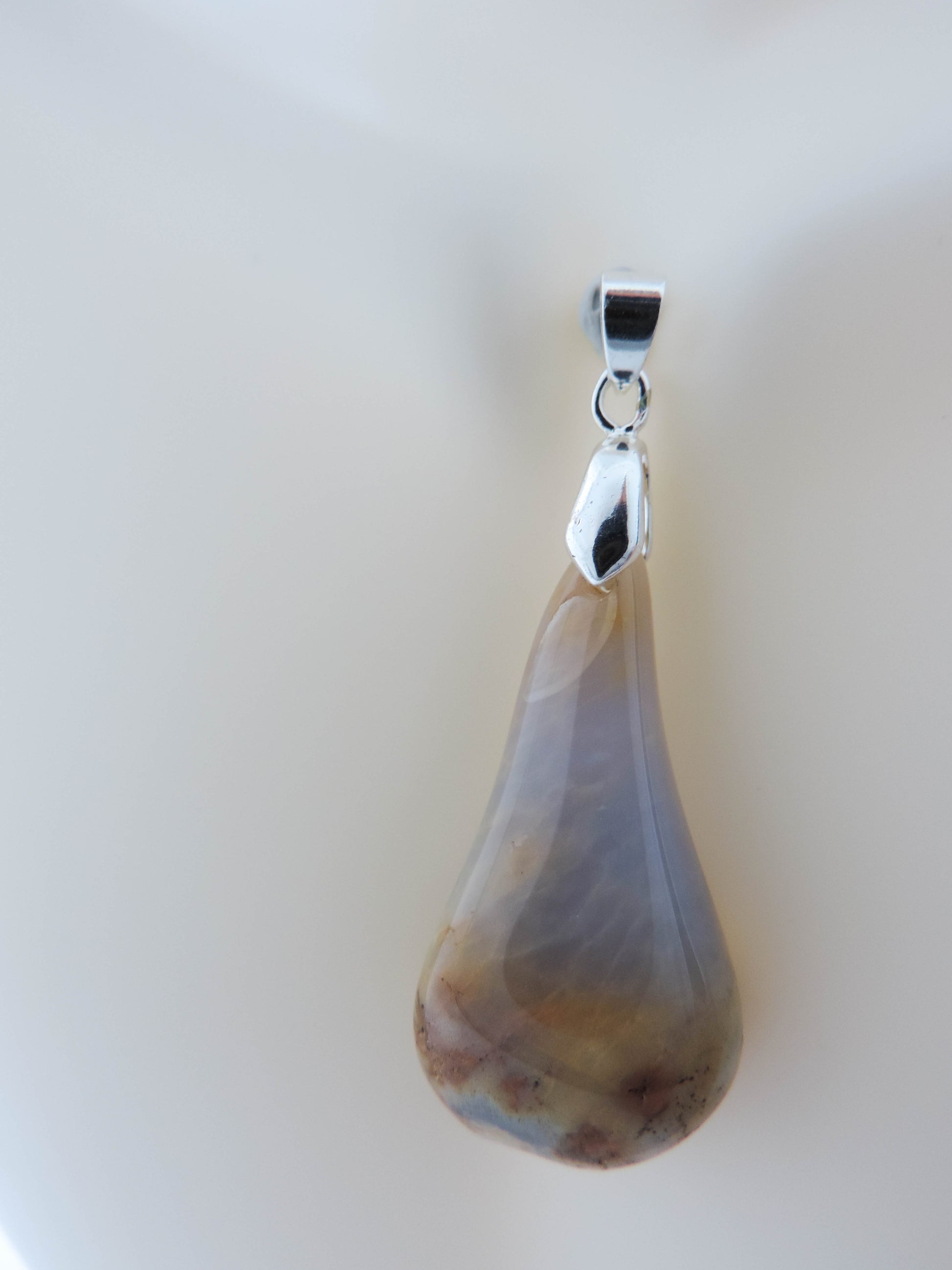 This rare stone is found in only a few locations in Montana, our material is hand collected on private property in the mountains and carried out in backpacks...each piece worth its weight in every step!  The translucent blue agate and its color variations have an alluring effect, many people find the blue agate a relaxing, calming and peaceful stone to wear.  Original and unique in design, each piece is hand crafted by lapidary artists in Montana.