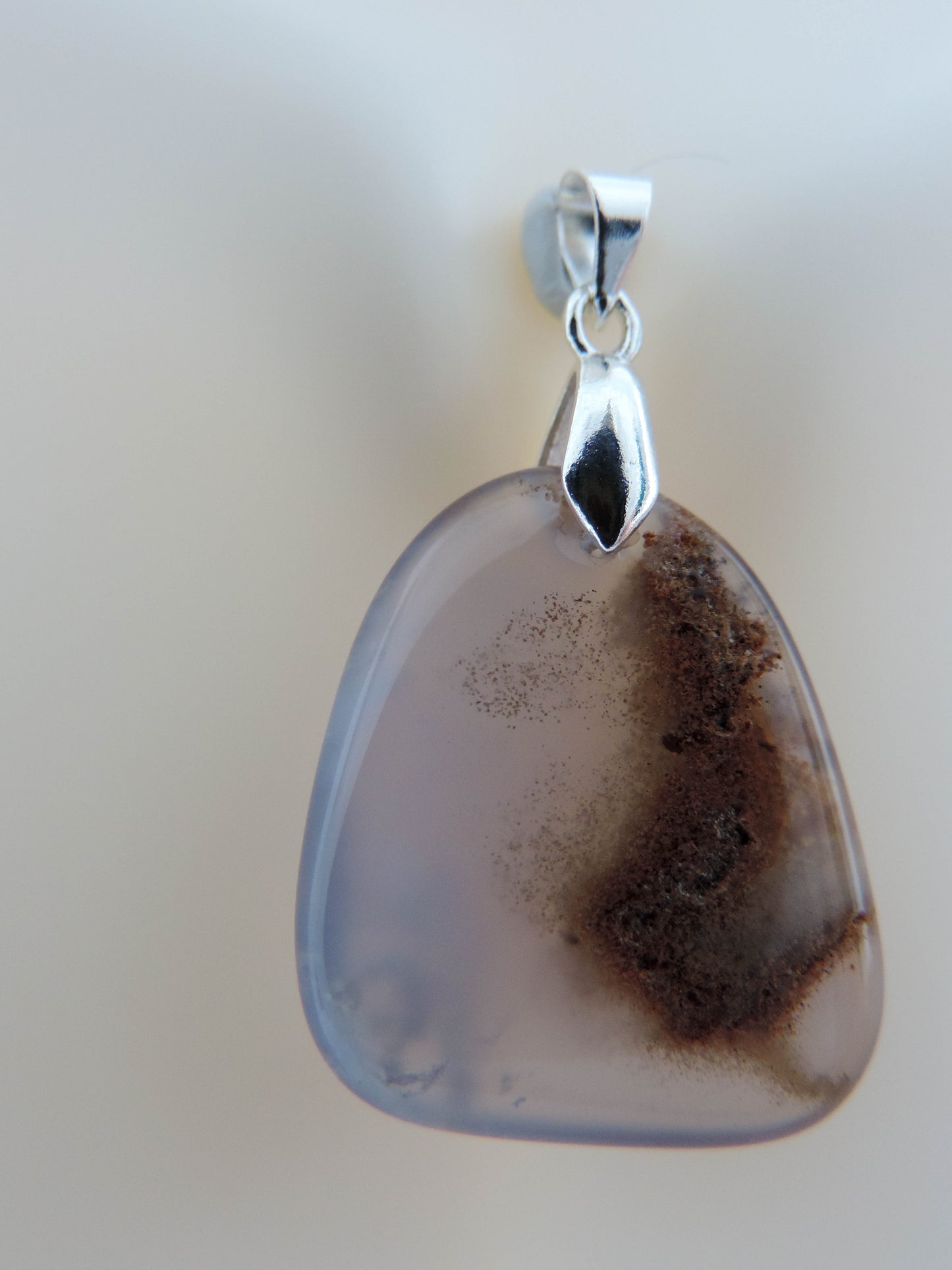 This rare stone is found in only a few locations in Montana, our material is hand collected on private property in the mountains and carried out in backpacks...each piece worth its weight in every step!  The translucent blue agate and its color variations have an alluring effect, many people find the blue agate a relaxing, calming and peaceful stone to wear.  Original and unique in design, each piece is hand crafted by lapidary artists in Montana.