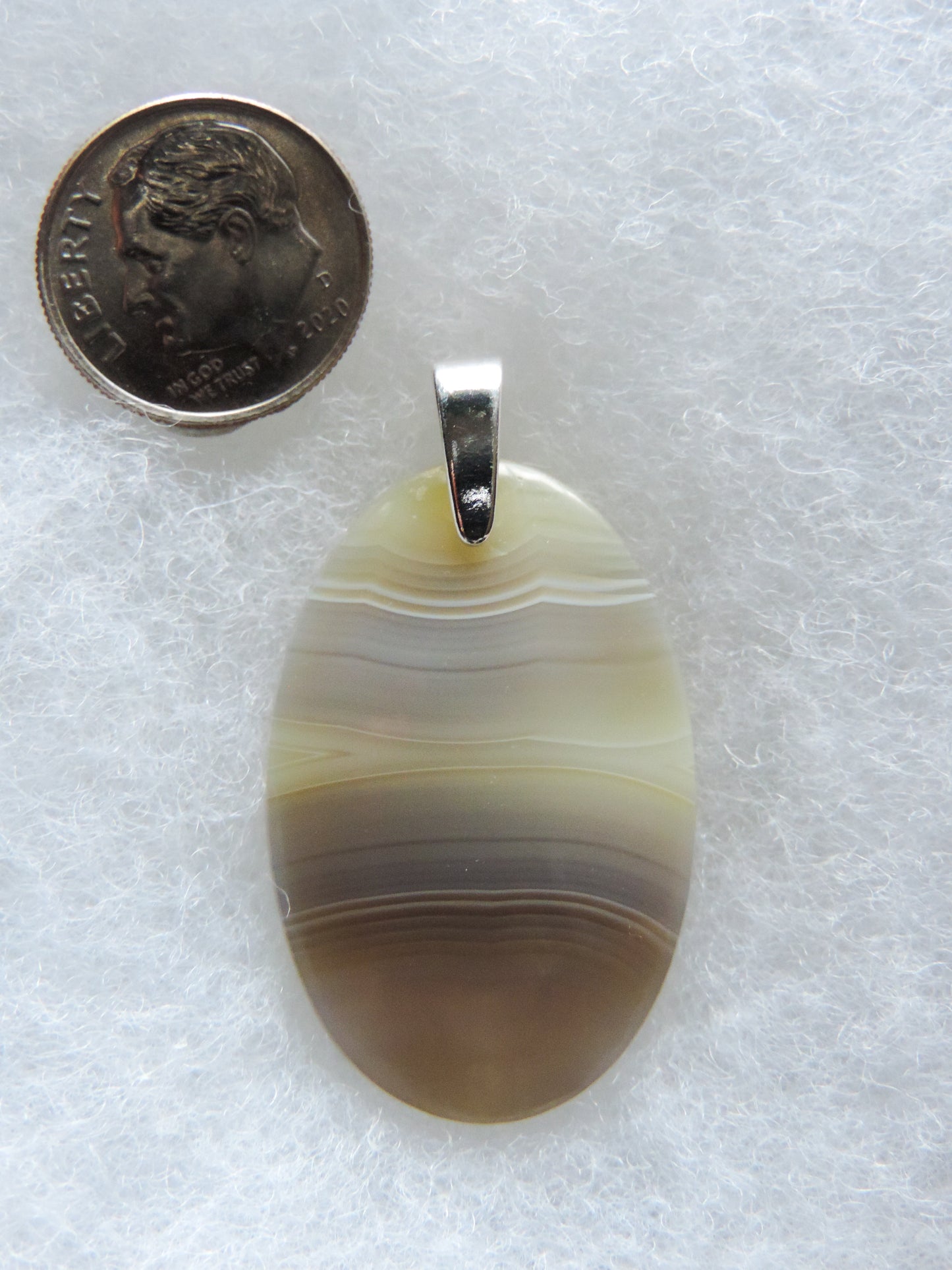 Find your perfect Indonesian Agate on our store! The pendant bail is authentic 925 sterling silver.