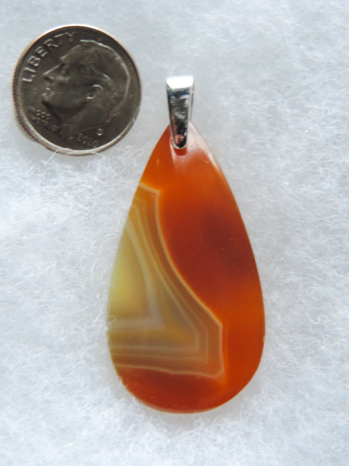 Find your perfect Indonesian Agate on our store! The pendant bail is authentic 925 sterling silver.