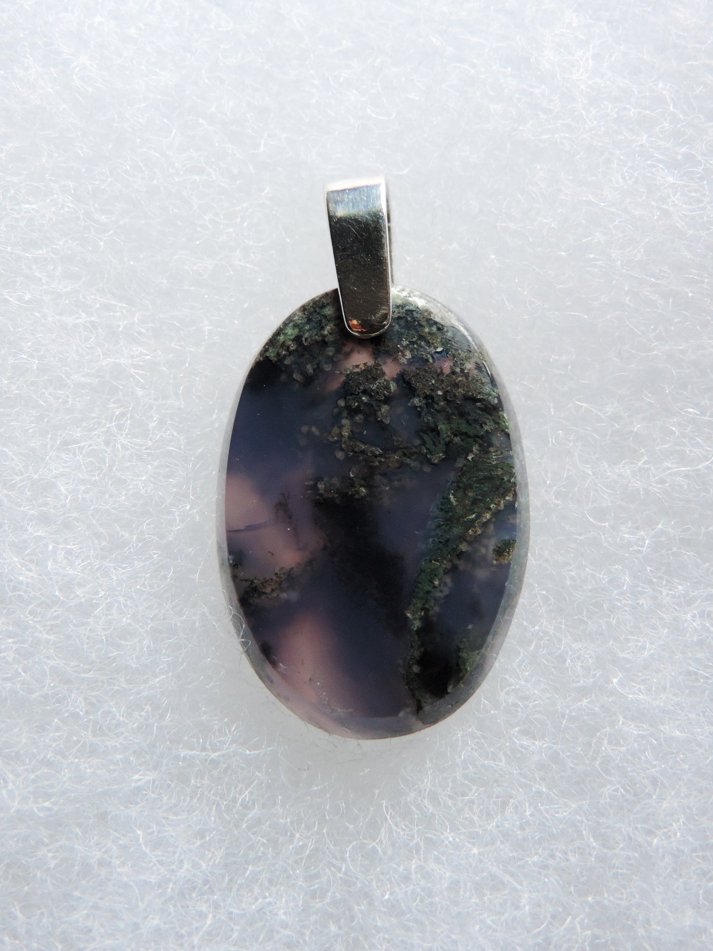 Purple Moss Agate & Sterling Silver Pendant. Purple gemstones hold significant and powerful spiritual qualities. Purple has been associated with wealth, passion, ambition, magic, awareness, mystery, tranquility, inspiration, understanding, calmness and wisdom to name a few.