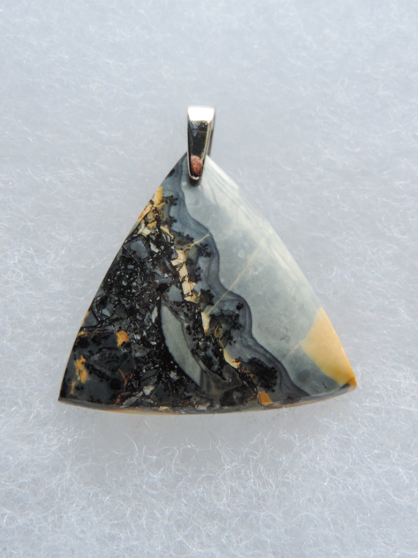 Maligano Jasper & Sterling Silver Pendant.  Maligano Jasper is a specific type of jasper found in Indonesia and forms in ancient volcanic hot springs areas.  It’s named after a small village in Sulawesi, Indonesia and is mined by hand as the village doesn’t have the heavy machinery required for deep excavation mining techniques.