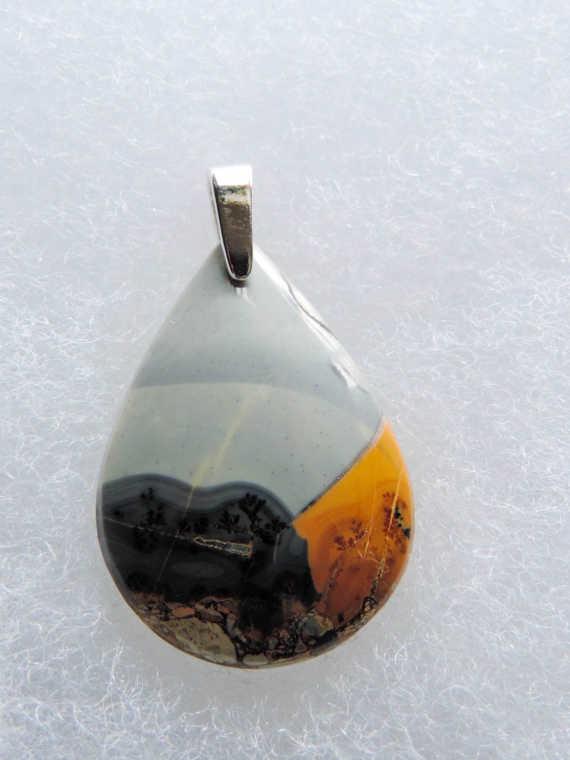 Exquisite in appearance, this Maligano Jasper & Sterling Silver Pendant will compliment your formal or casual attire.   The pendant bail is authentic 925 sterling silver.
