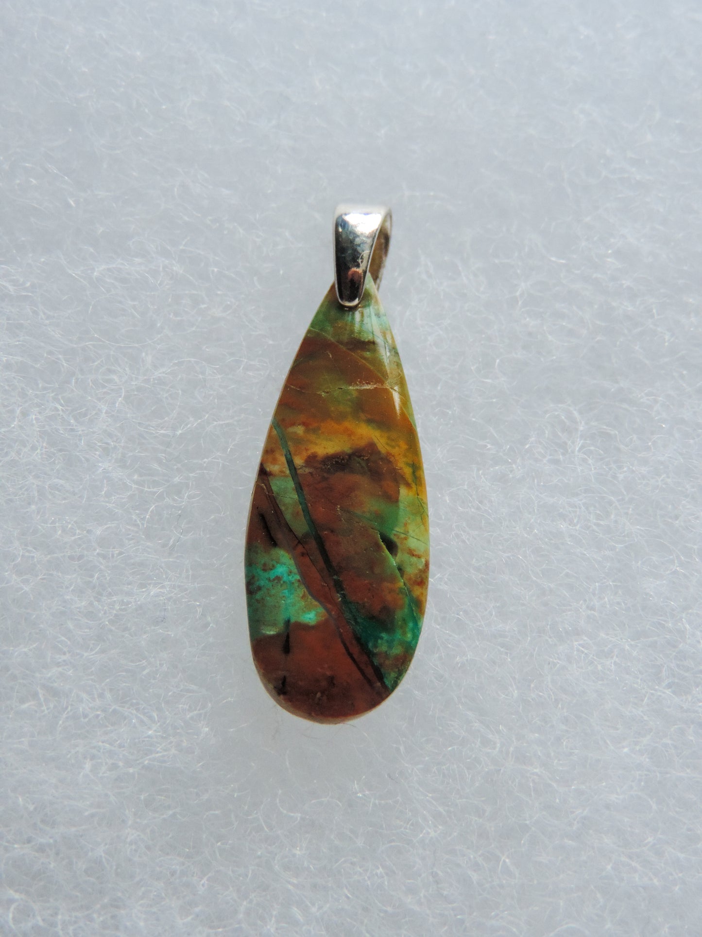 Indonesian Blue Opalized Wood & Sterling Silver Pendant. Extremely rare and lovely, Indonesian Blue Opalized Wood is a cherished material used by lapidary artists for creating stunning pieces of jewelry