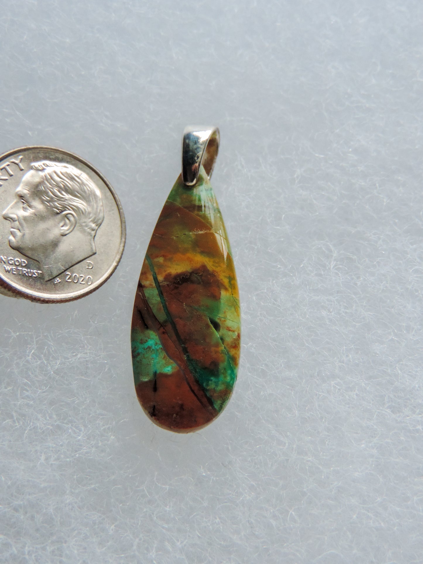 Extremely rare and lovely, Indonesian Blue Opalized Wood is a cherished material used by lapidary artists for creating stunning pieces of jewelry. This material was first found as pebbles and rounded stones in streams and near the slopes of three volcanoes in the West Java Province. The source deposit, an ancient petrified forest covered with pyroclastic flow from a volcanic eruption, was located in 2017 on the steep slopes of Mt. Tjakalak.