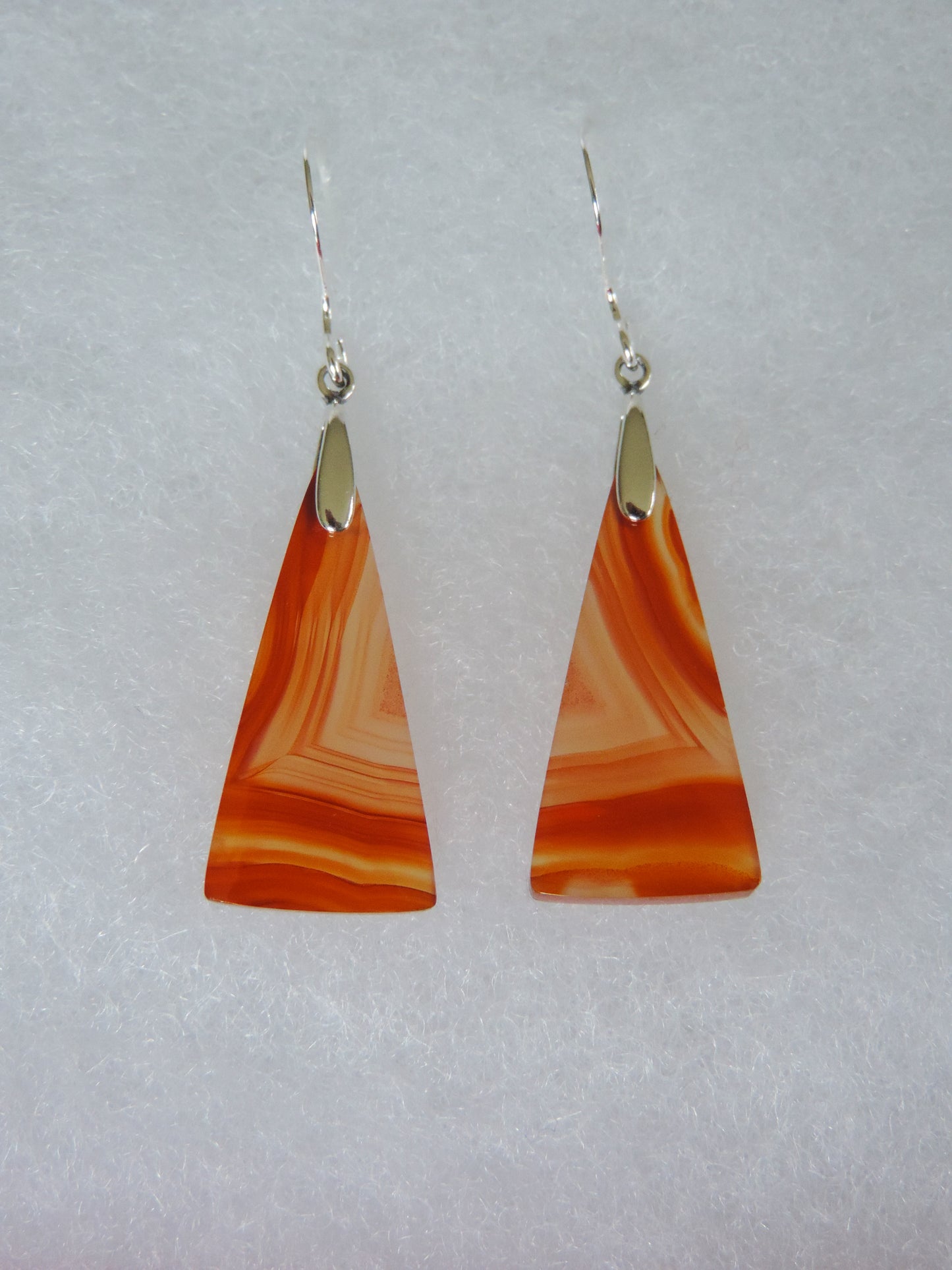 Carnelian Agate & Sterling Silver Earrings Indonesian Carnelian Agates exhibit a wide variety of colors and amazing complexity. No two agates are exactly alike, each one being a unique and beautiful creation! Agates with multiple bands of color are known as fortification agates, those with dendritic or moss looking inclusions are referred to as moss agate and many others are given descriptive names relative to their appearance or where they are found.