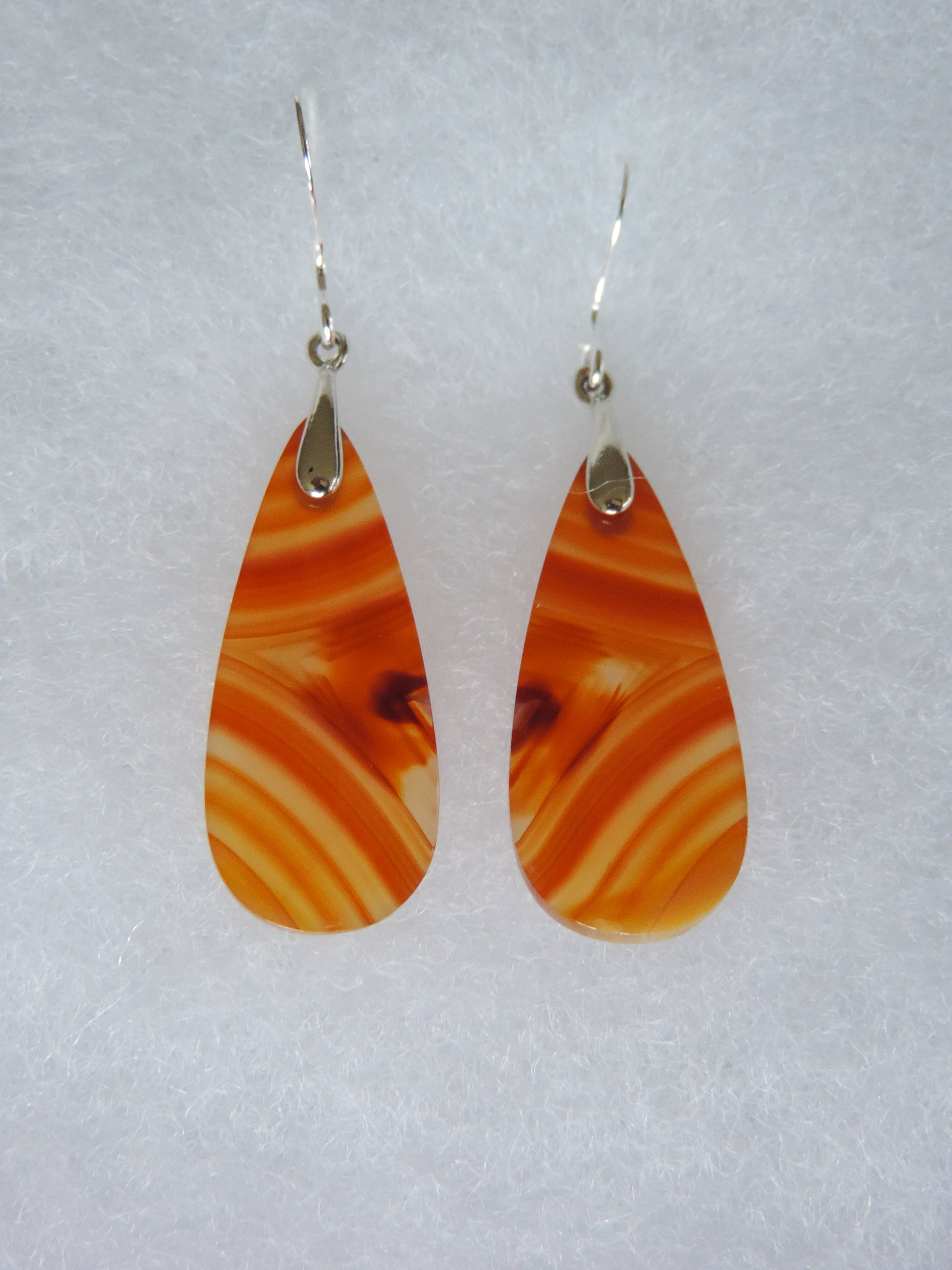 This stone is a natural color, no dyes or heat treatment have been used.  It was photographed without filters on automatic setting in natural light; however, slight color variations may occur due to digitization.  Natural stones can have nooks and crannies, inclusions or small cracks, these distinguishing features lend character to the piece