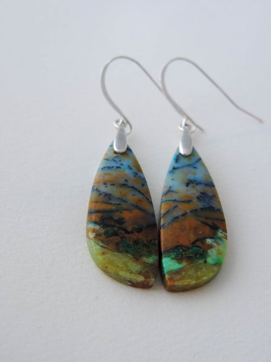 Indonesian Blue Opalized Wood & Sterling Silver Earrings  Extremely rare and lovely, Indonesian Blue Opalized Wood is a cherished material used by lapidary artists for creating stunning pieces of jewelry.