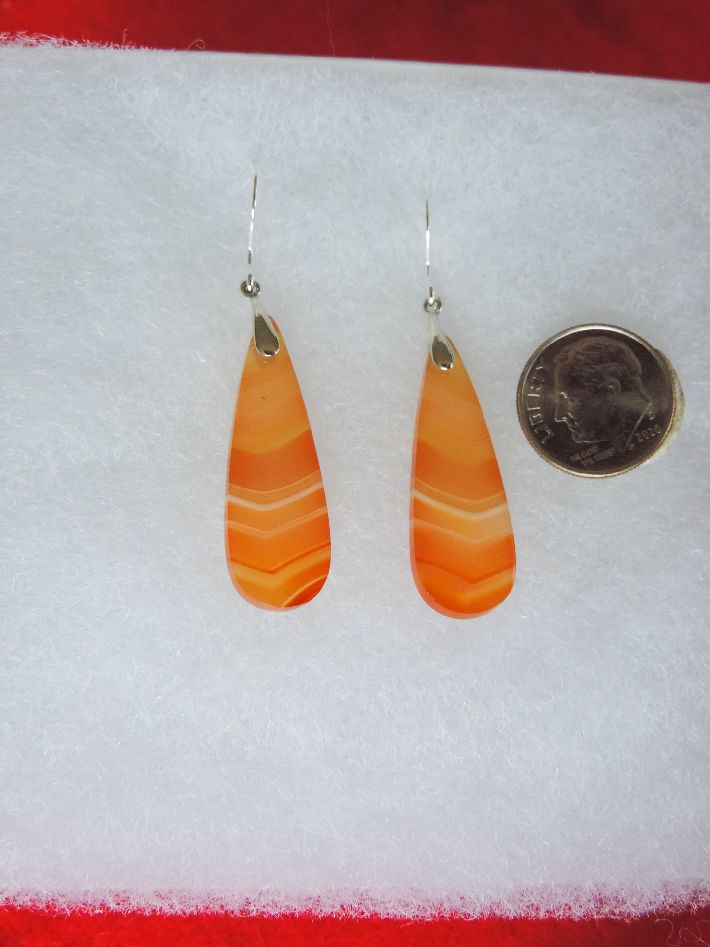 This Carnelian stone is a natural color, no dyes or heat treatment have been used. It was photographed without filters on automatic setting in natural light; however, slight color variations may occur due to digitization. Natural stones can have nooks and crannies, inclusions or small cracks, these distinguishing features lend character to the piece.
